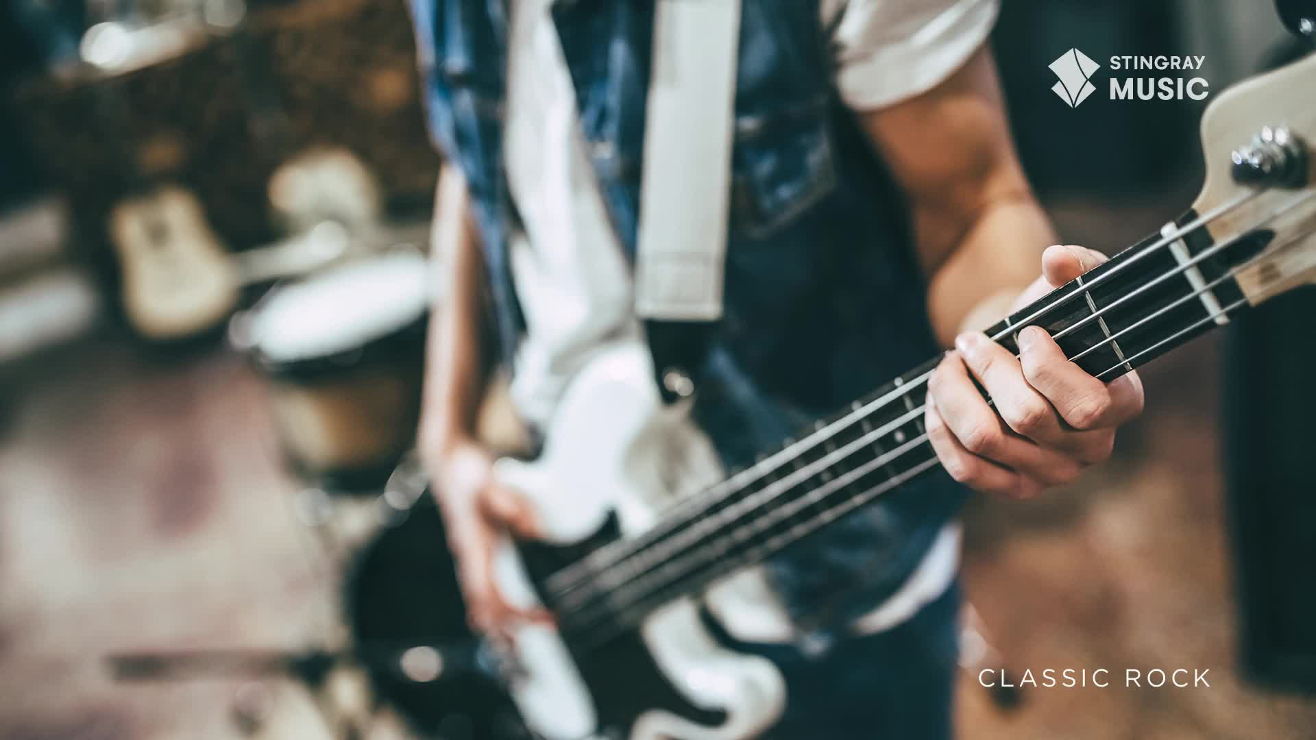 A musician's fingers dance across the strings of a white bass guitar. The instrument is held close, ready to deliver a classic rock riff, courtesy of Stingray Music in Canada.
A musician's fingers dance across the strings of a white bass guitar. The instrument is held close, ready to deliver a classic rock riff, courtesy of Stingray Music in Canada.