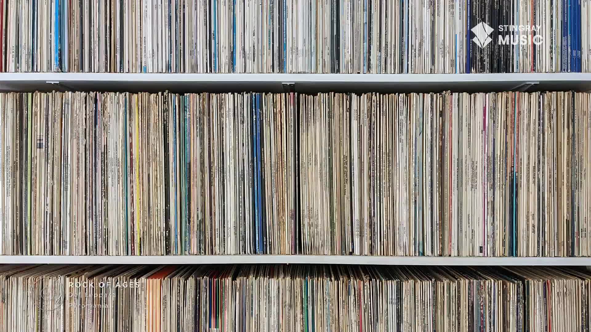 Shelves are packed with vinyl records, a collection that spans genres, including the classic rock Stingray Music plays in Canada. The spines form a textured wall of colour and age.
Shelves are packed with vinyl records, a collection that spans genres, including the classic rock Stingray Music plays in Canada. The spines form a textured wall of colour and age.