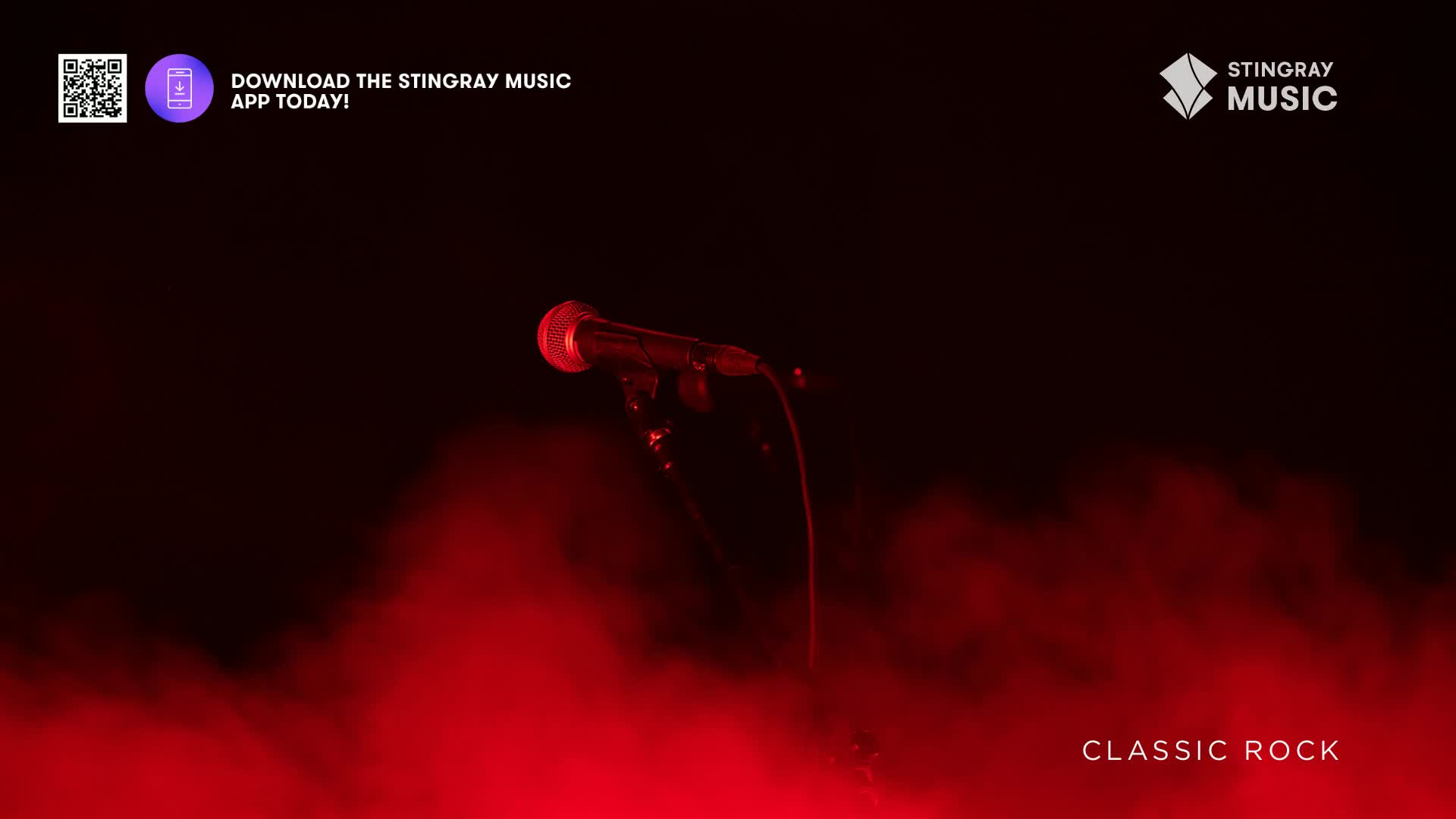 A microphone stands alone, lit by a red spotlight against a dark backdrop. The words "Classic Rock" are visible, suggesting a Stingray Music concert is about to begin.
A microphone stands alone, lit by a red spotlight against a dark backdrop. The words "Classic Rock" are visible, suggesting a Stingray Music concert is about to begin.