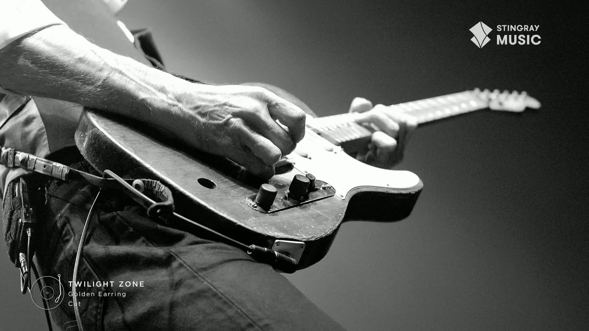 Fingers dance across the fretboard of a classic electric guitar, the notes of "Twilight Zone" by Golden Earring filling the air. The Stingray Music logo suggests this is a performance for a Canadian audience.
