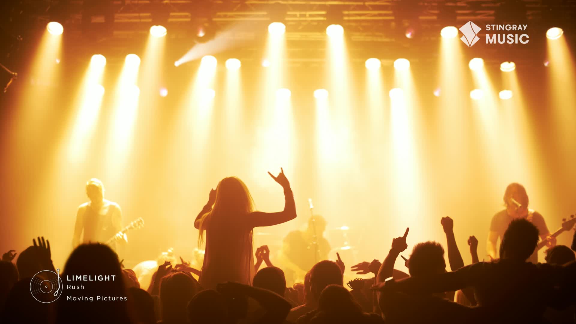 The stage lights blaze, illuminating a band playing classic rock. A woman in the crowd throws up devil horns, her silhouette stark against the golden glow.
