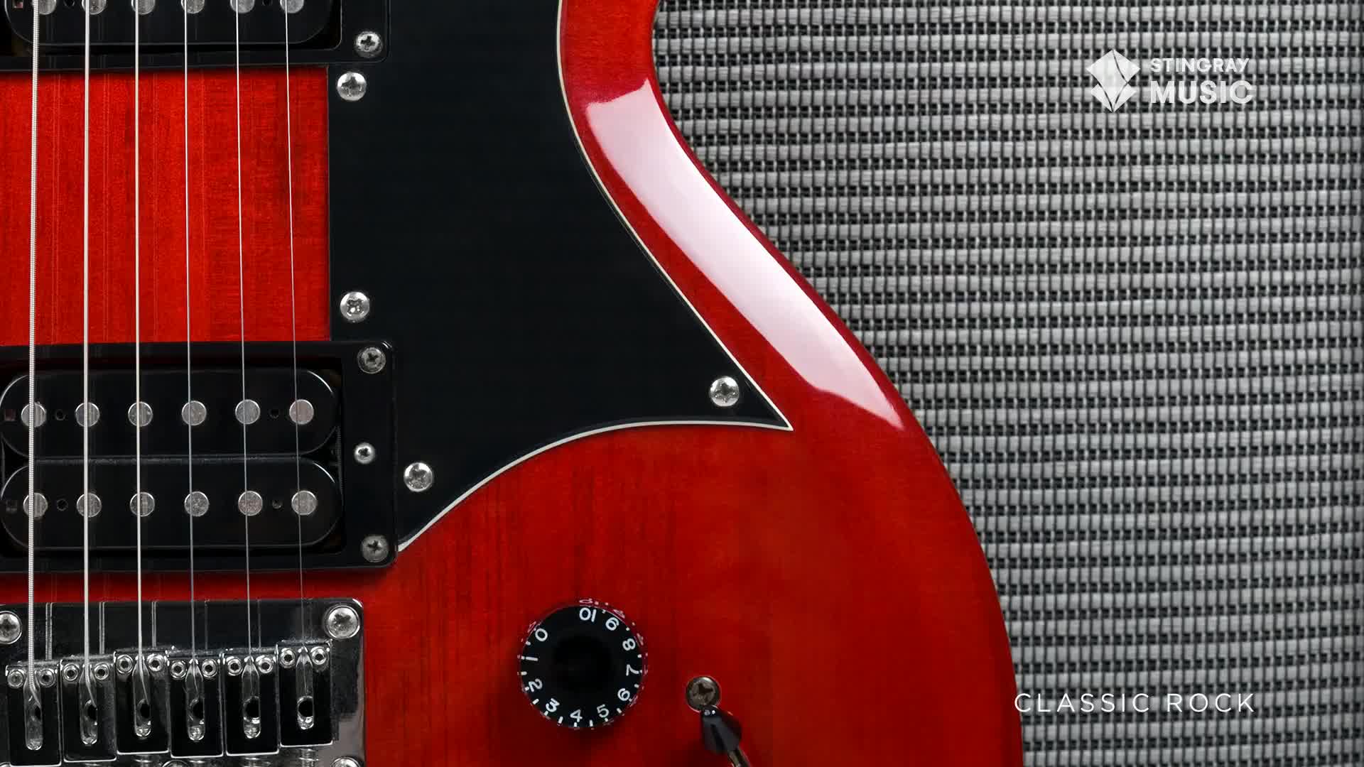 A gleaming red electric guitar rests against a textured amplifier. The "Stingray Music" logo is visible on the amp, hinting at the classic rock sound this setup is built for.