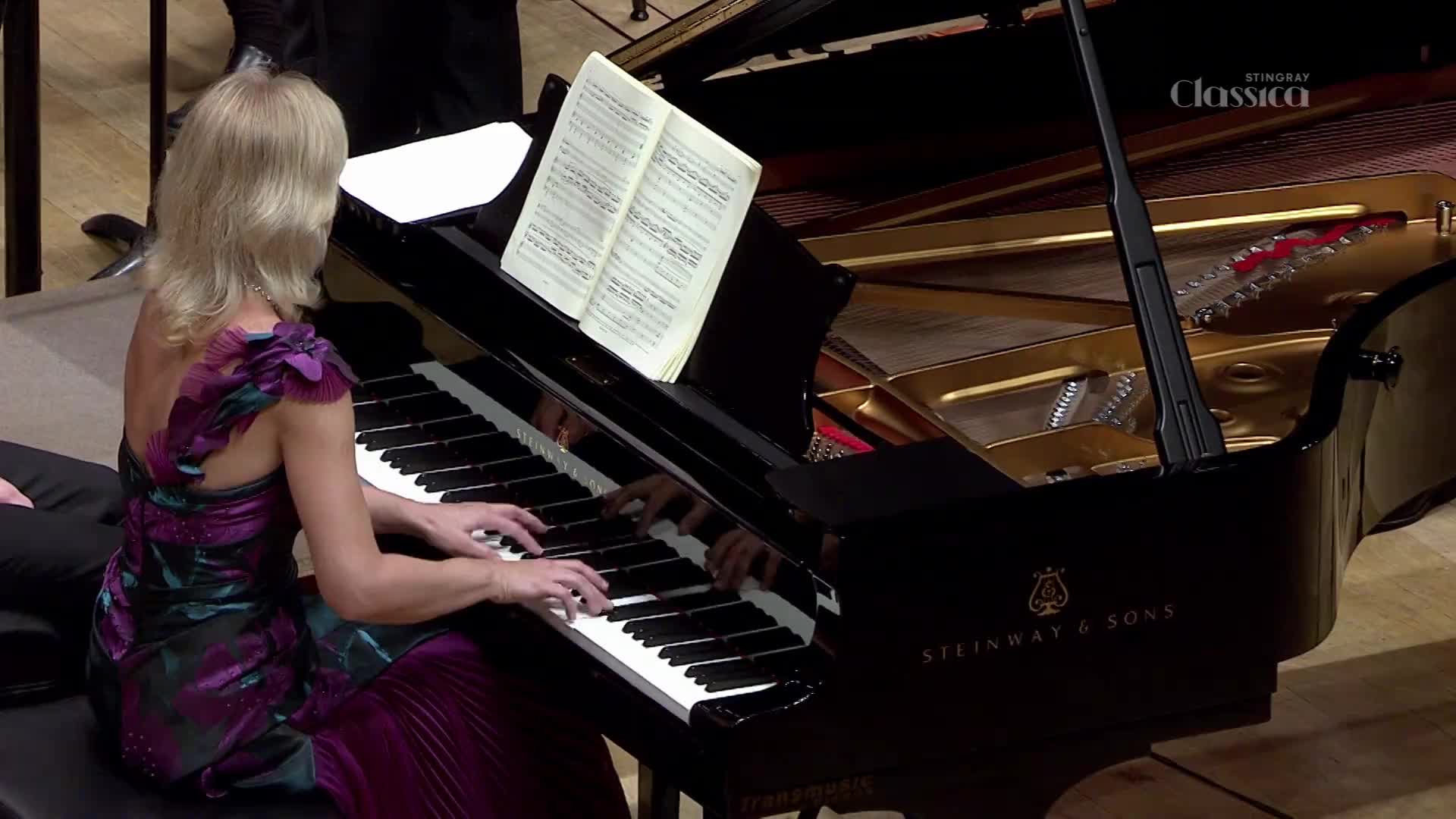 Her fingers dance across the keys of a Steinway, the notes flowing from the instrument. The music is broadcast on Stingray Classica, a Canadian station.
