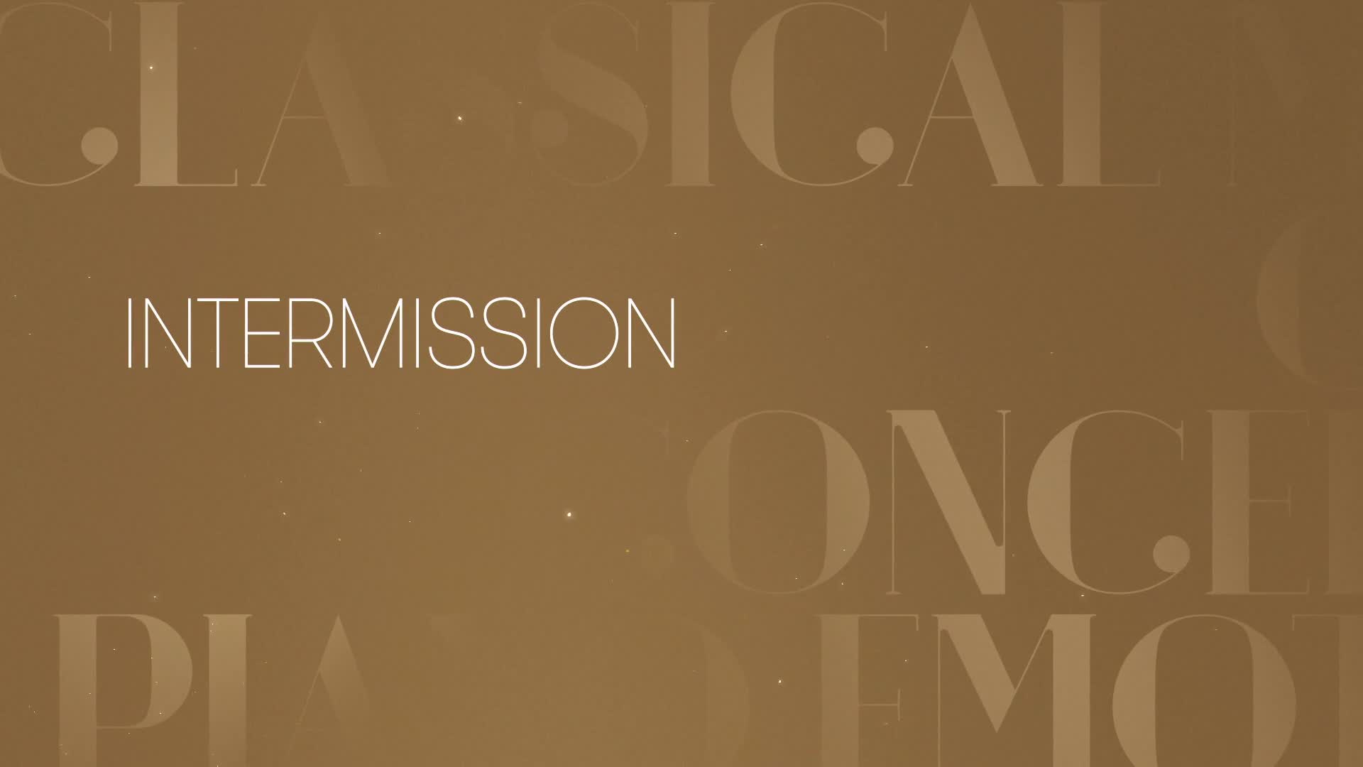 "Intermission" is displayed in elegant white lettering against a warm, golden backdrop, with the word "Classical" faintly visible above. Tiny, sparkling particles drift gently across the screen, like a soft snowfall on a Canadian winter evening.
