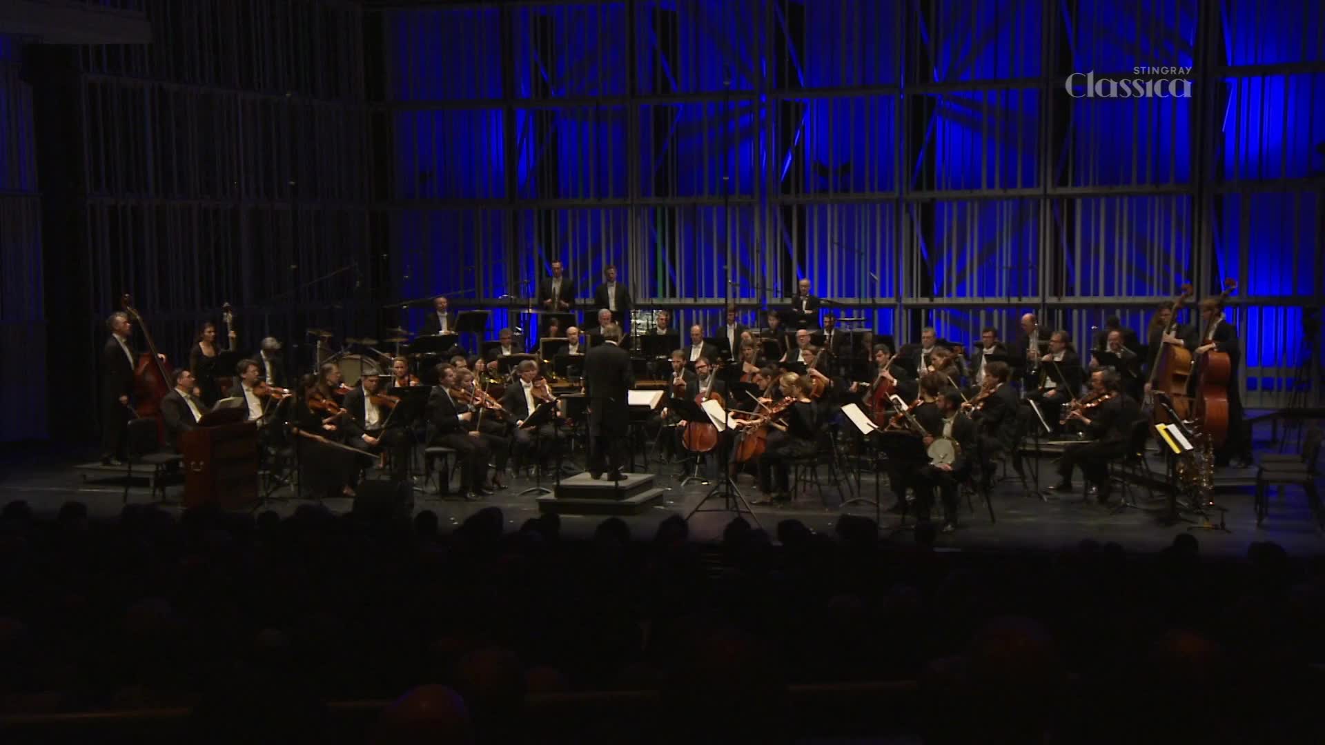 The conductor's baton arcs, and the musicians raise their instruments in response.  On the Stingray Classica stage, the orchestra is ready to play.
