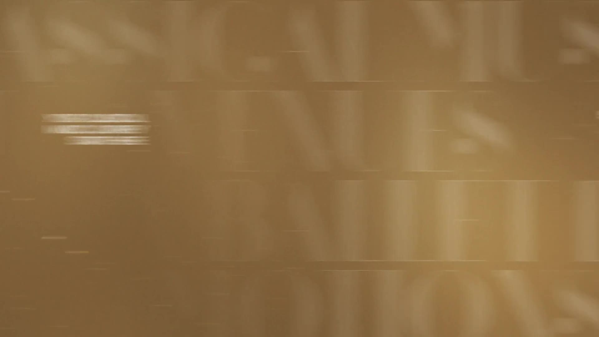 A white text box streaks across the screen, its words blurring into a horizontal line. Behind it, large, faded letters stretch and distort, hinting at a grand title or a classic name.