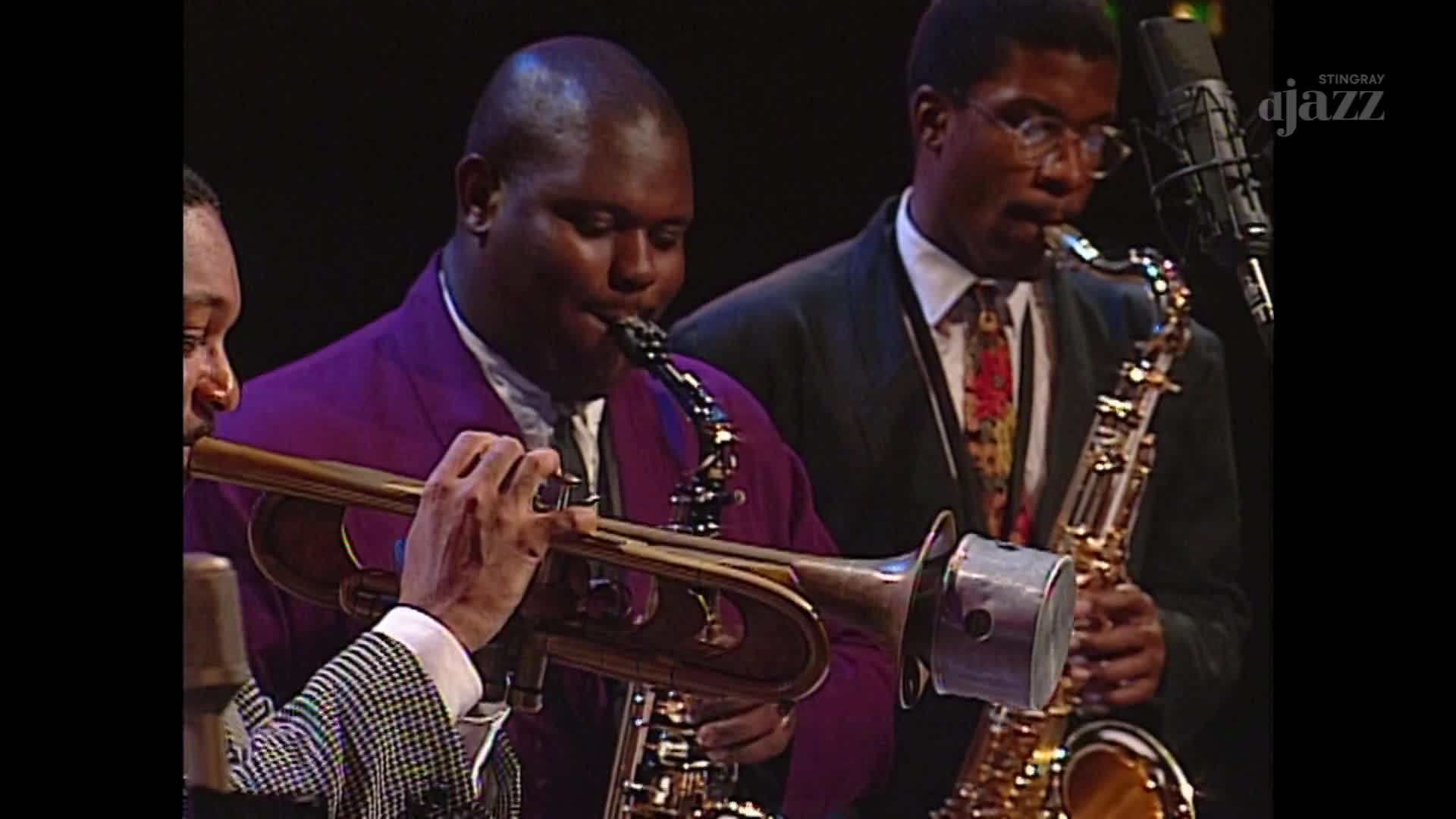 The musicians, captured in Canada on Stingray DJAZZ, are deeply focused, their instruments raised. The trumpet player's fingers dance over the valves, while the saxophonists blow with intense concentration.
