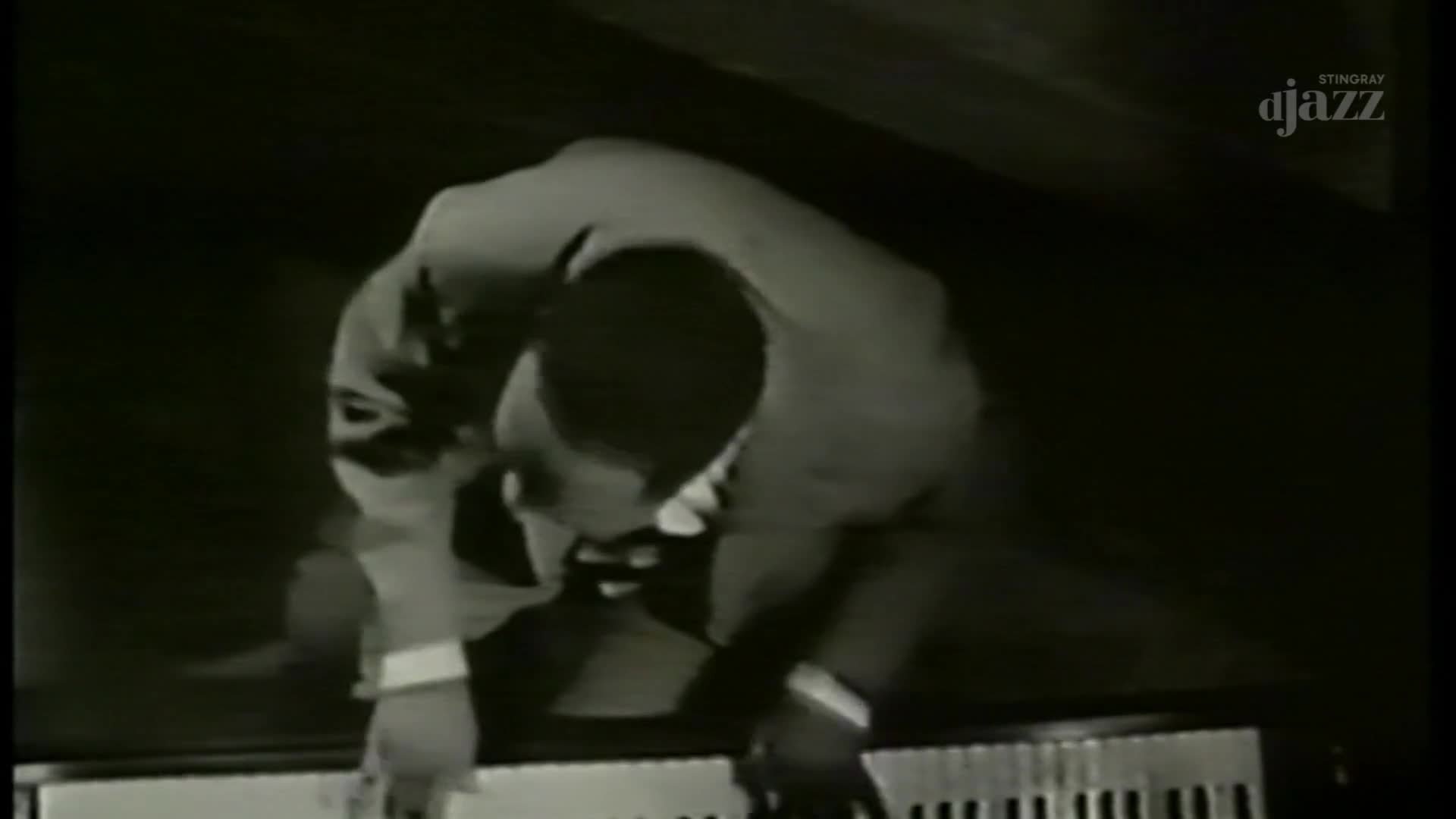 A pianist leans over the keys, his hands poised to play. The Stingray DJAZZ logo appears in the corner, hinting at a Canadian broadcast.