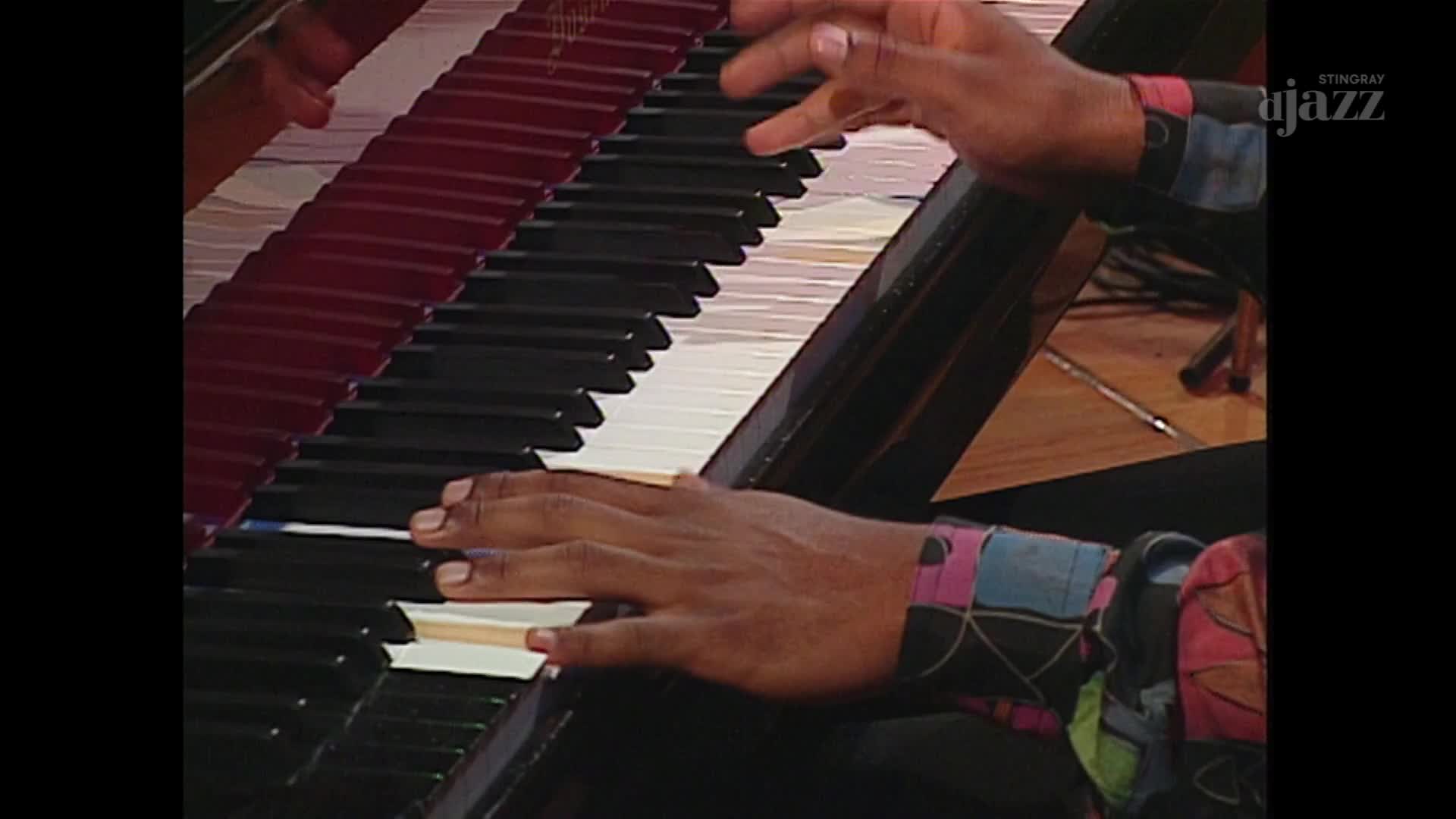 Fingers dance across the piano keys, a vibrant, patterned sleeve peeking out. The Stingray DJAZZ logo is visible in the corner, a subtle nod to the Canadian broadcast.