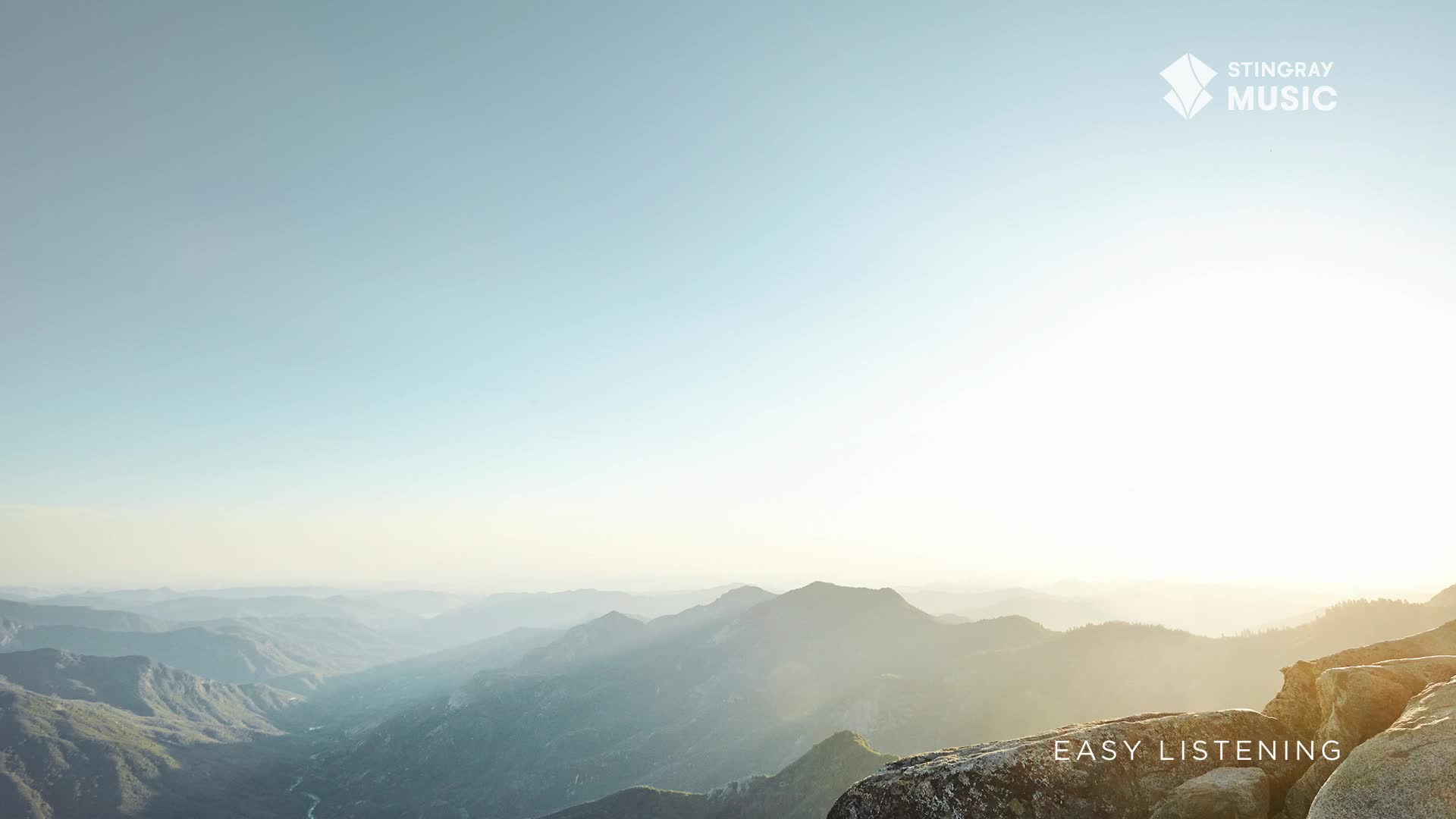 The sun is just starting to light up the peaks of the distant mountains, a scene that feels like a perfect soundtrack for Stingray Easy Listening in Canada. The sky is a clear, pale blue, and the air feels crisp and clean.
