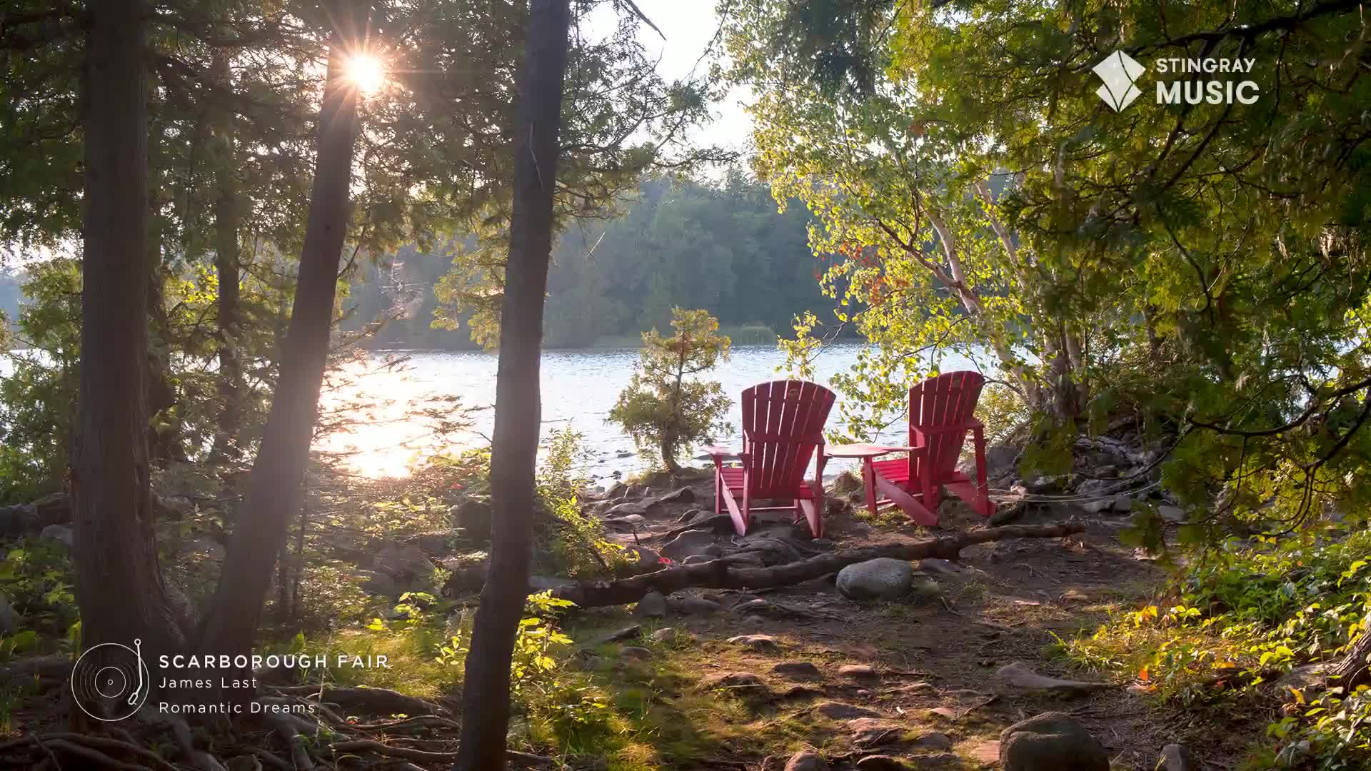 The sun bursts through the trees, illuminating two red Muskoka chairs perched on a rocky shoreline. It’s a perfect scene for listening to Stingray Easy Listening, a soundtrack to this Canadian lakeside.
