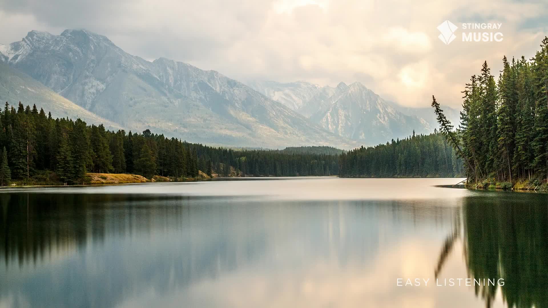 The calm lake mirrors the distant mountains and the trees lining the shore. It's a peaceful scene, perfect for the easy listening broadcast from Canada.
The calm lake mirrors the distant mountains and the trees lining the shore. It's a peaceful scene, perfect for the easy listening broadcast from Canada.
