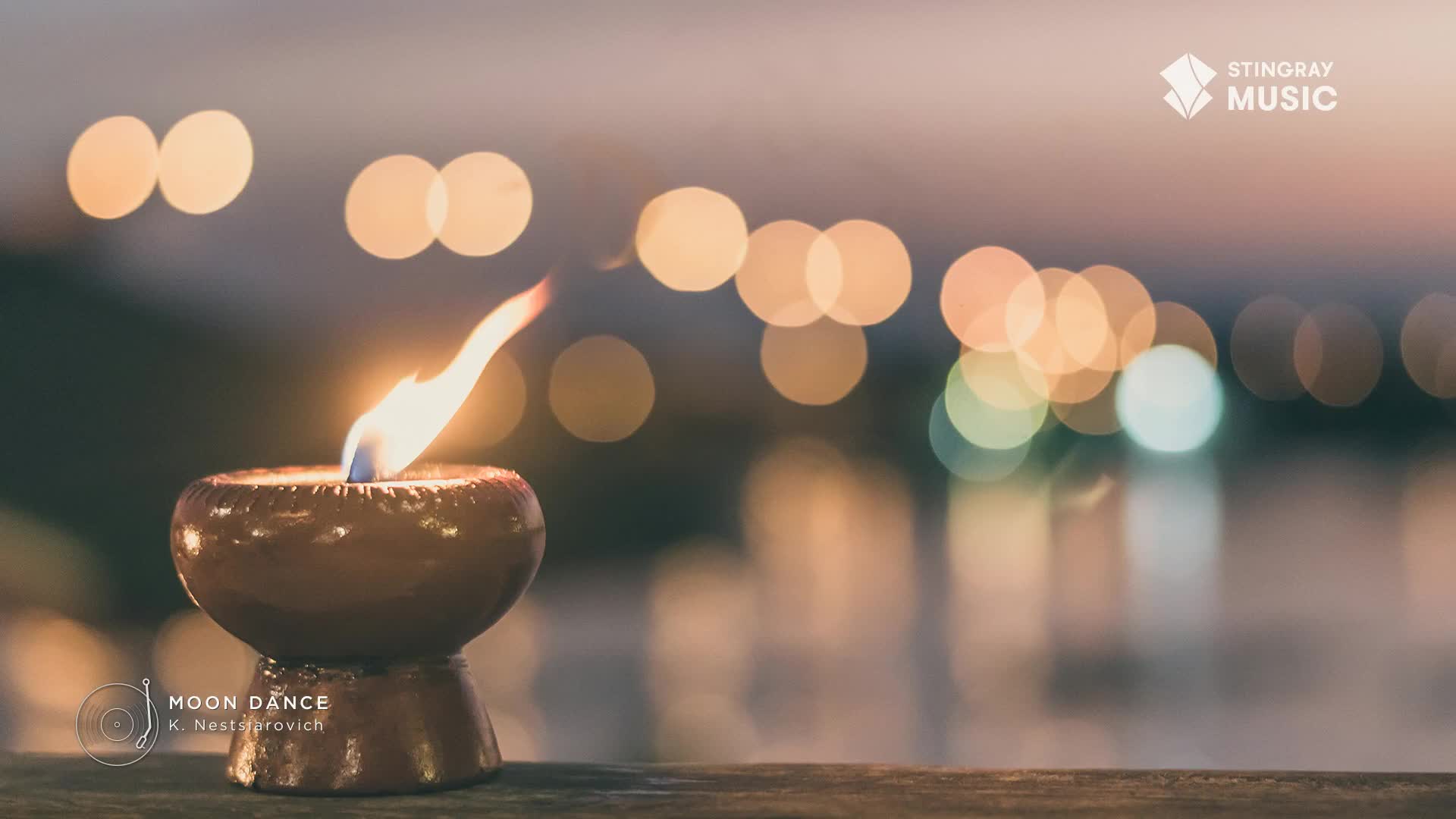 A small, ceramic bowl holds a flickering flame, its light dancing in the wind. Behind it, soft, out-of-focus lights suggest a city at dusk, perhaps the backdrop for a Stingray Easy Listening broadcast from Canada.
A small, ceramic bowl holds a flickering flame, its light dancing in the wind. Behind it, soft, out-of-focus lights suggest a city at dusk, perhaps the backdrop for a Stingray Easy Listening broadcast from Canada.