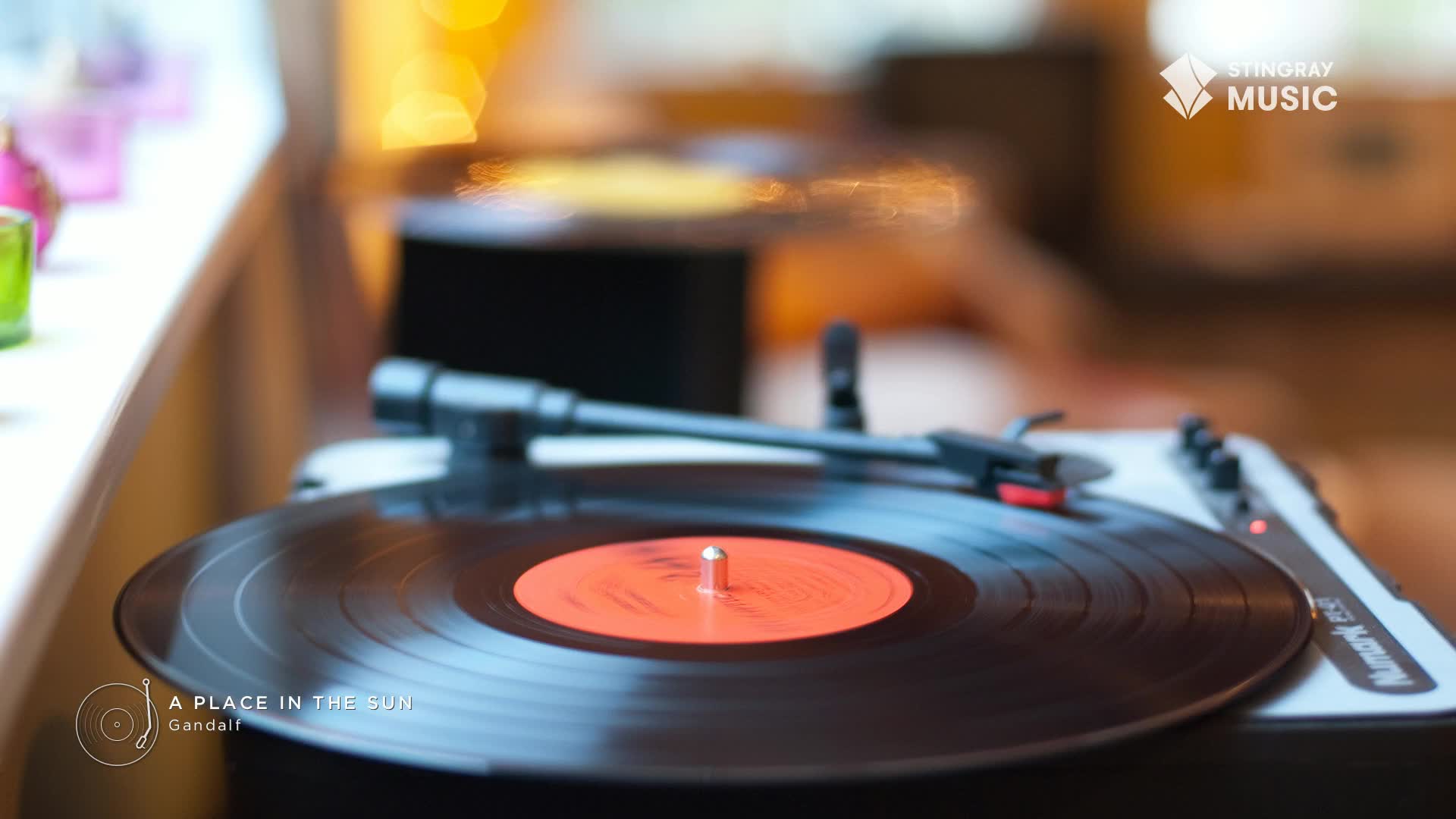A black vinyl record spins on a turntable, its orange label catching the light. The needle rests in the groove, ready to play some Stingray Easy Listening from Canada.