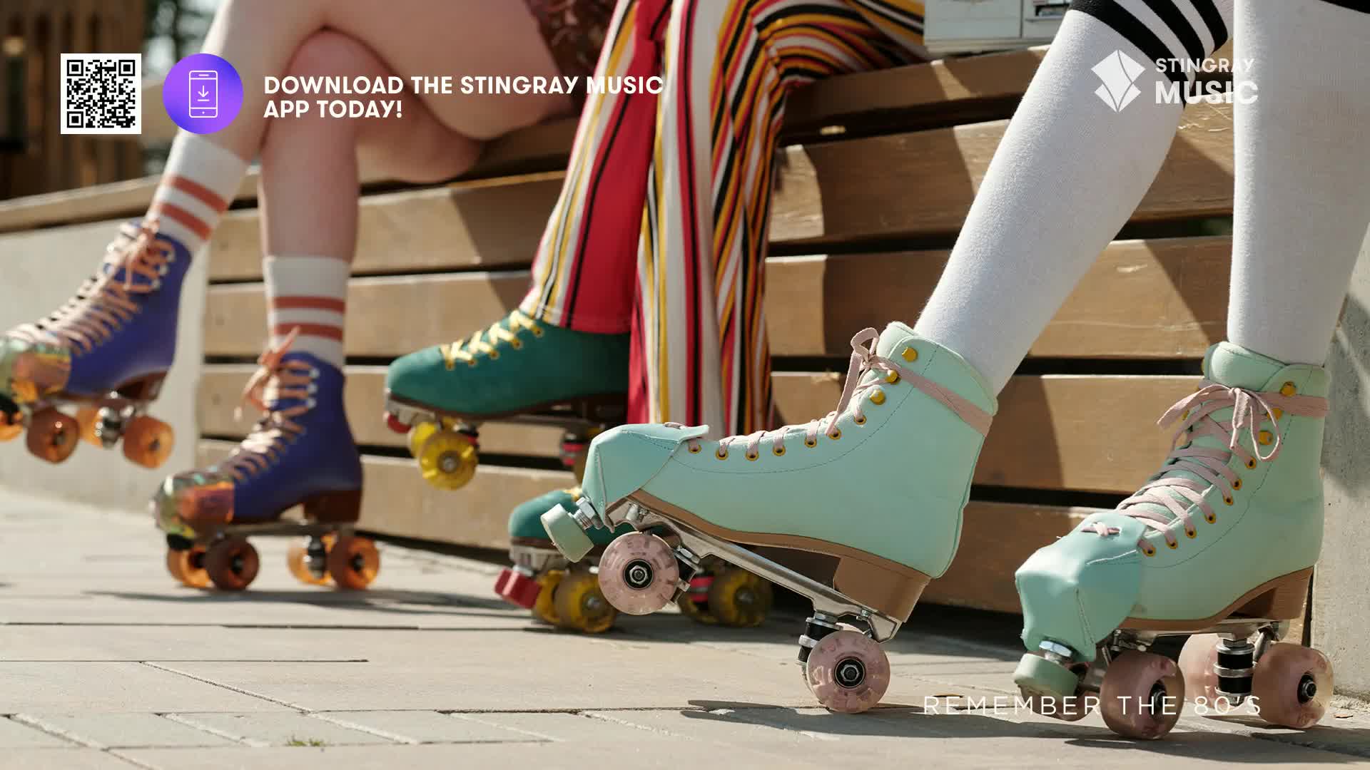 Brightly colored roller skates are lined up, resting on a paved surface. The pastel green and blue skates are a throwback to the Stingray Everything '80s vibe, reminding me of carefree summer days.
