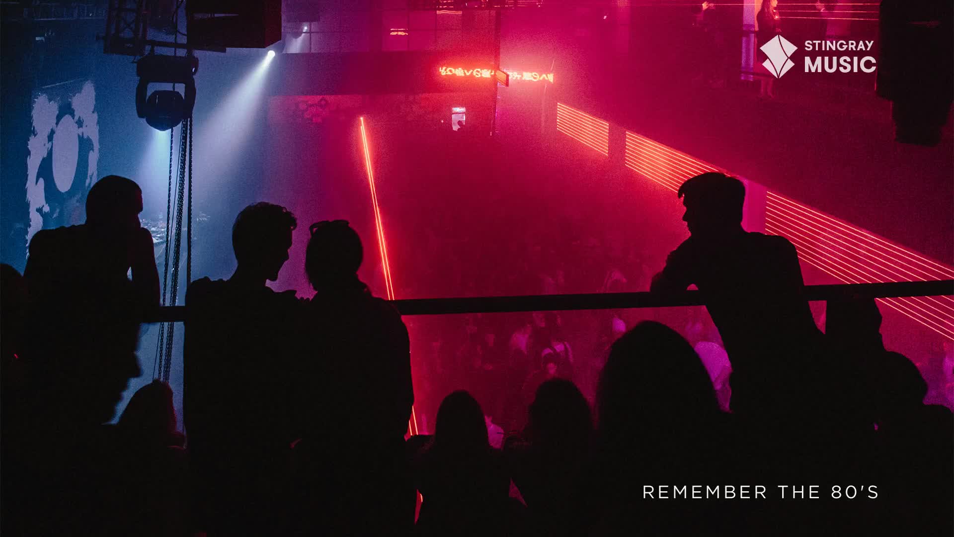 The crowd is a dark silhouette against the neon red and blue lights. Up above, the Stingray Music logo is visible, and the words "Remember the 80's" are at the bottom.
