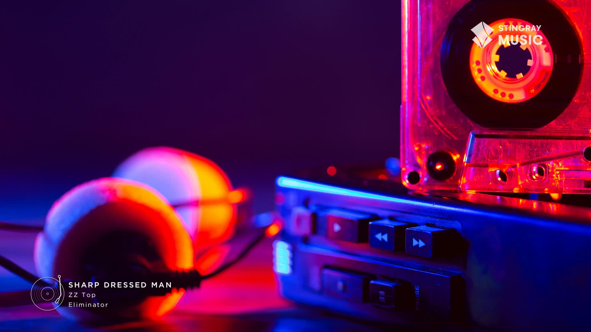 A cassette player sits bathed in neon light, with a tape nestled inside. The headphones are glowing, ready to blast some ZZ Top from Canada's Stingray Everything '80s.
