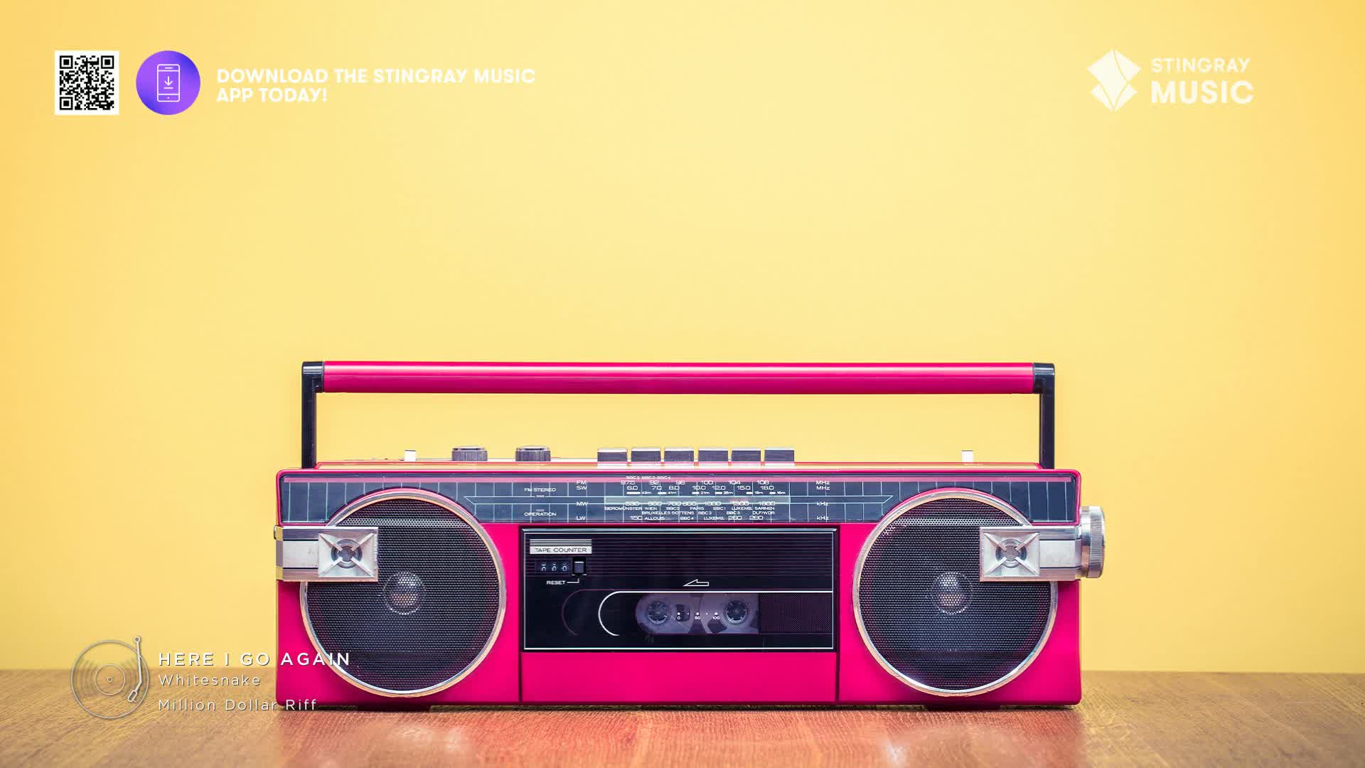 A vibrant pink boombox sits on a wooden surface, its cassette deck ready to play. The Stingray Music logo and a QR code for their app are visible, hinting at a Canadian connection to this '80s throwback.