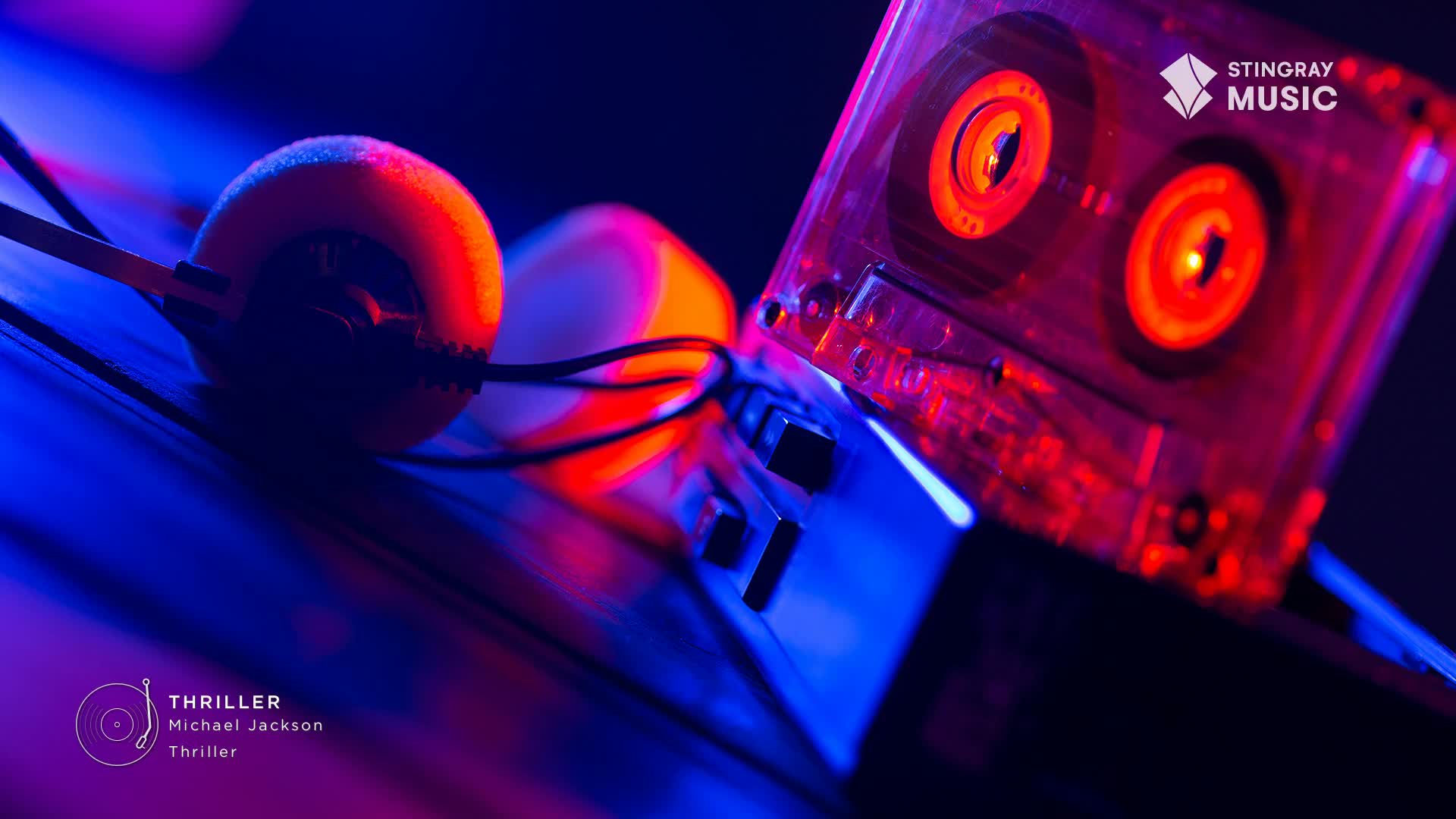 The orange glow of the cassette tape reels catches the light, just as it did in the '80s. A pair of headphones rests beside it, ready for a trip back to the era of "Thriller."