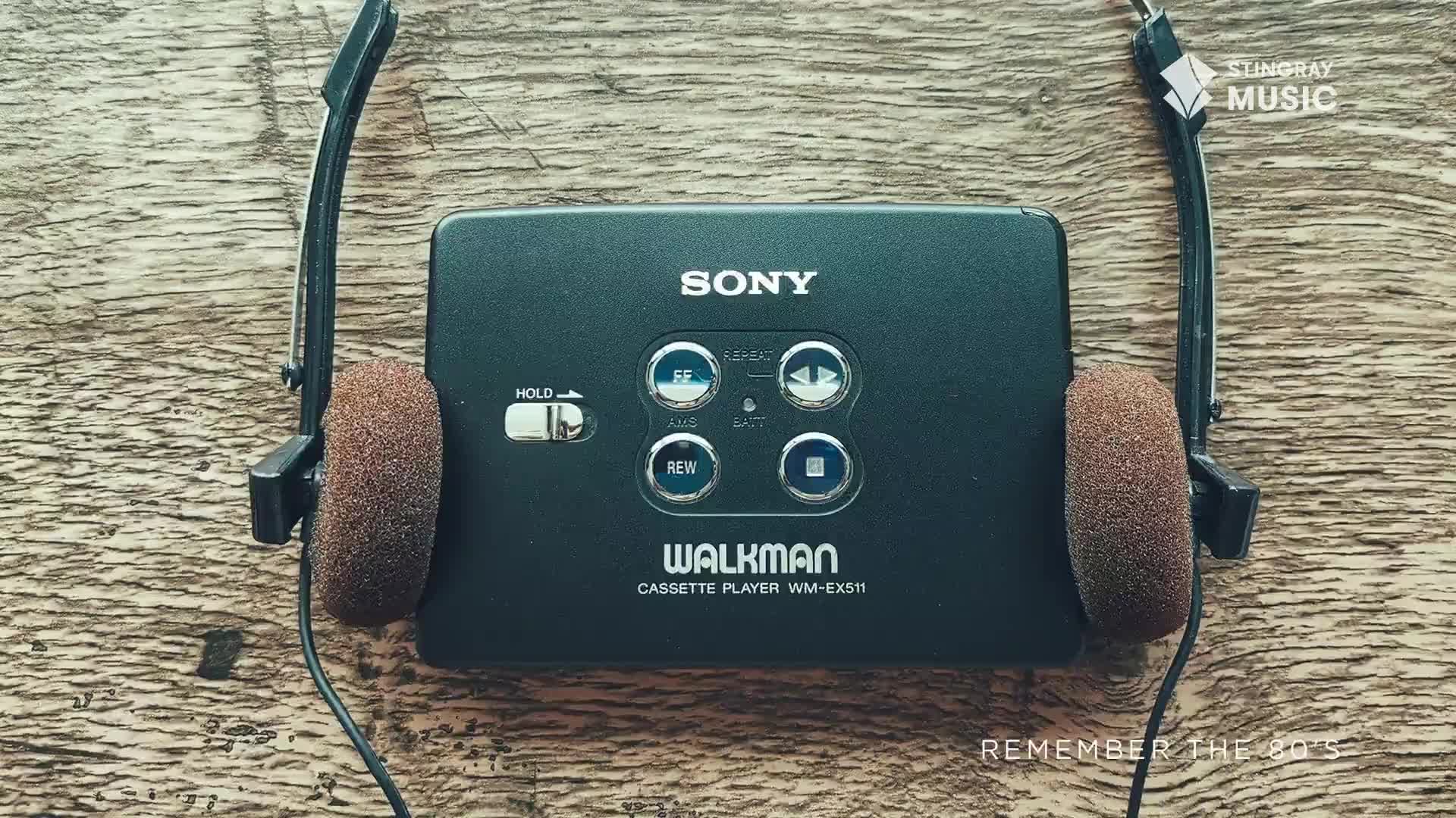 A Sony Walkman cassette player sits on a wooden surface, its foam headphones resting on either side. This portable music player evokes the spirit of Stingray's Everything '80s programming, a true Canadian throwback.