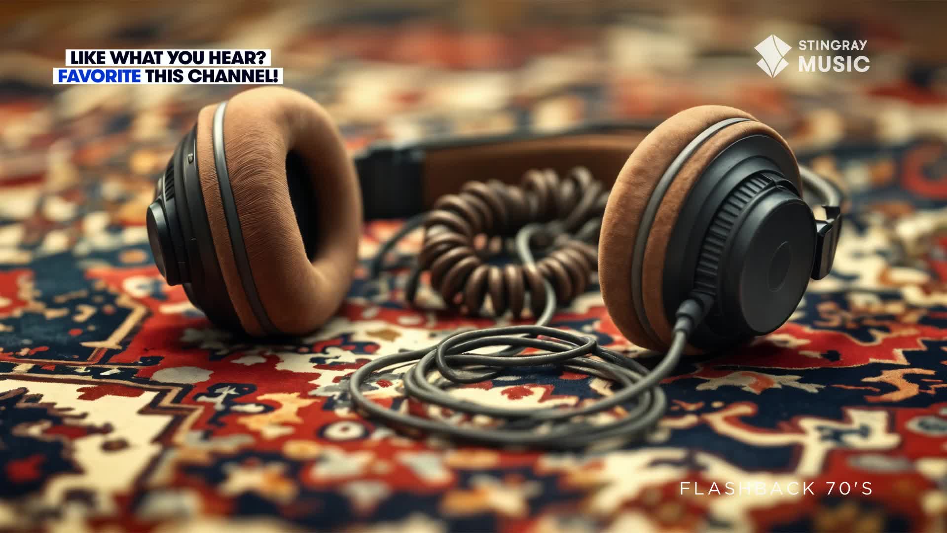 The headphones, with their brown earcups, rest on a patterned rug, their coiled cord snaking across the surface. The Stingray Music logo and "Flashback 70's" text suggest a Canadian channel playing retro tunes.
