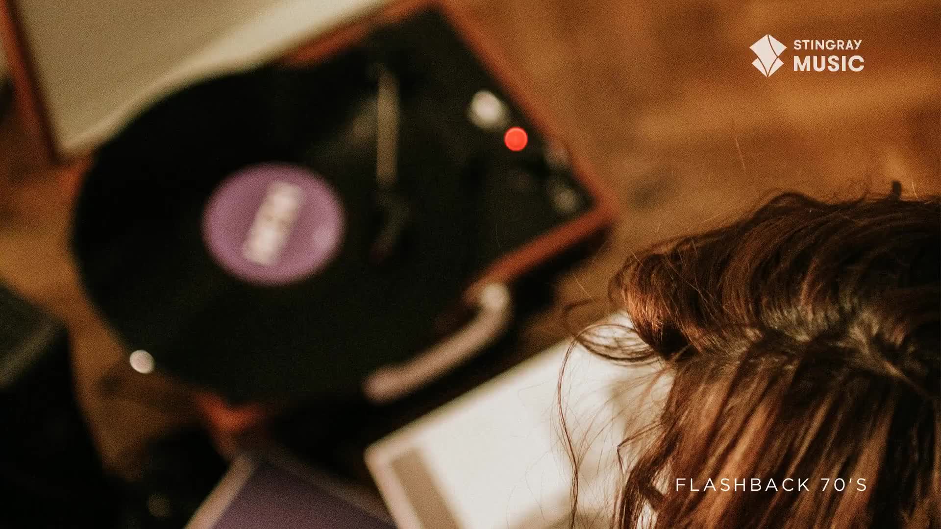 A record spins on a turntable, the needle tracing its grooves. The scene feels like a Stingray Flashback to the 70s, a moment of nostalgia in Canada.
