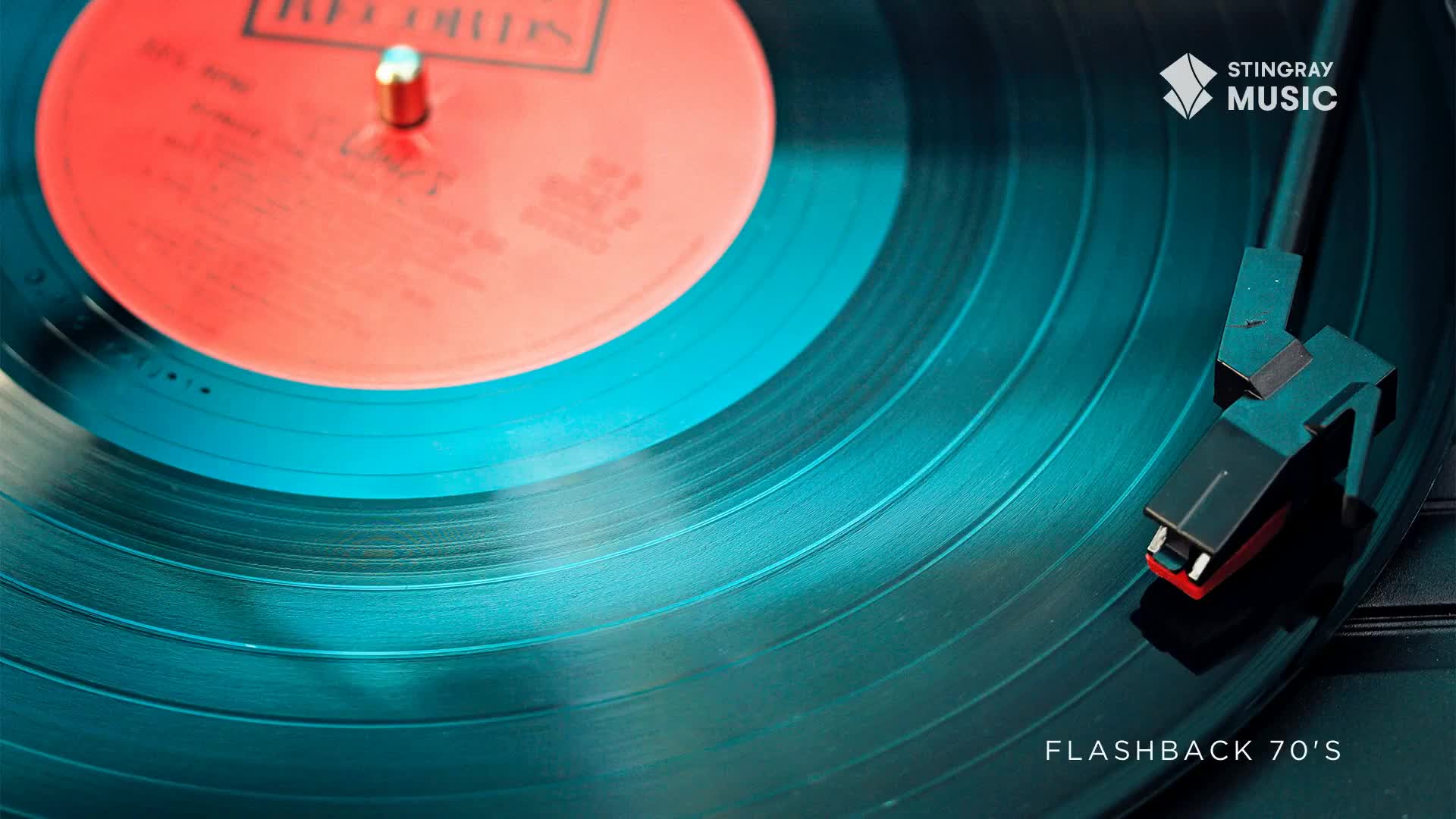 The needle rests on a spinning vinyl record, ready to play a classic from the Stingray Flashback 70's. The red label spins in the center, promising a blast from the past.
