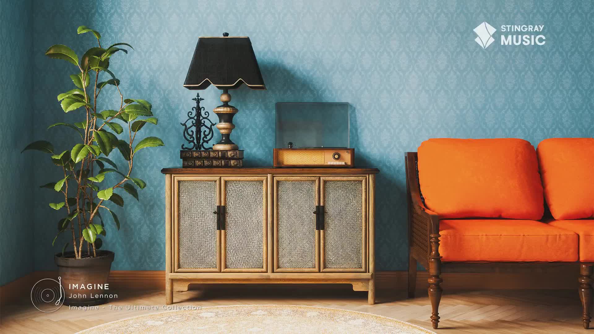 A vintage record player sits atop a wooden cabinet, ready to play a classic tune. The room's decor, with its orange couch and patterned blue wallpaper, evokes a 70s vibe, perfect for Stingray Flashback.
