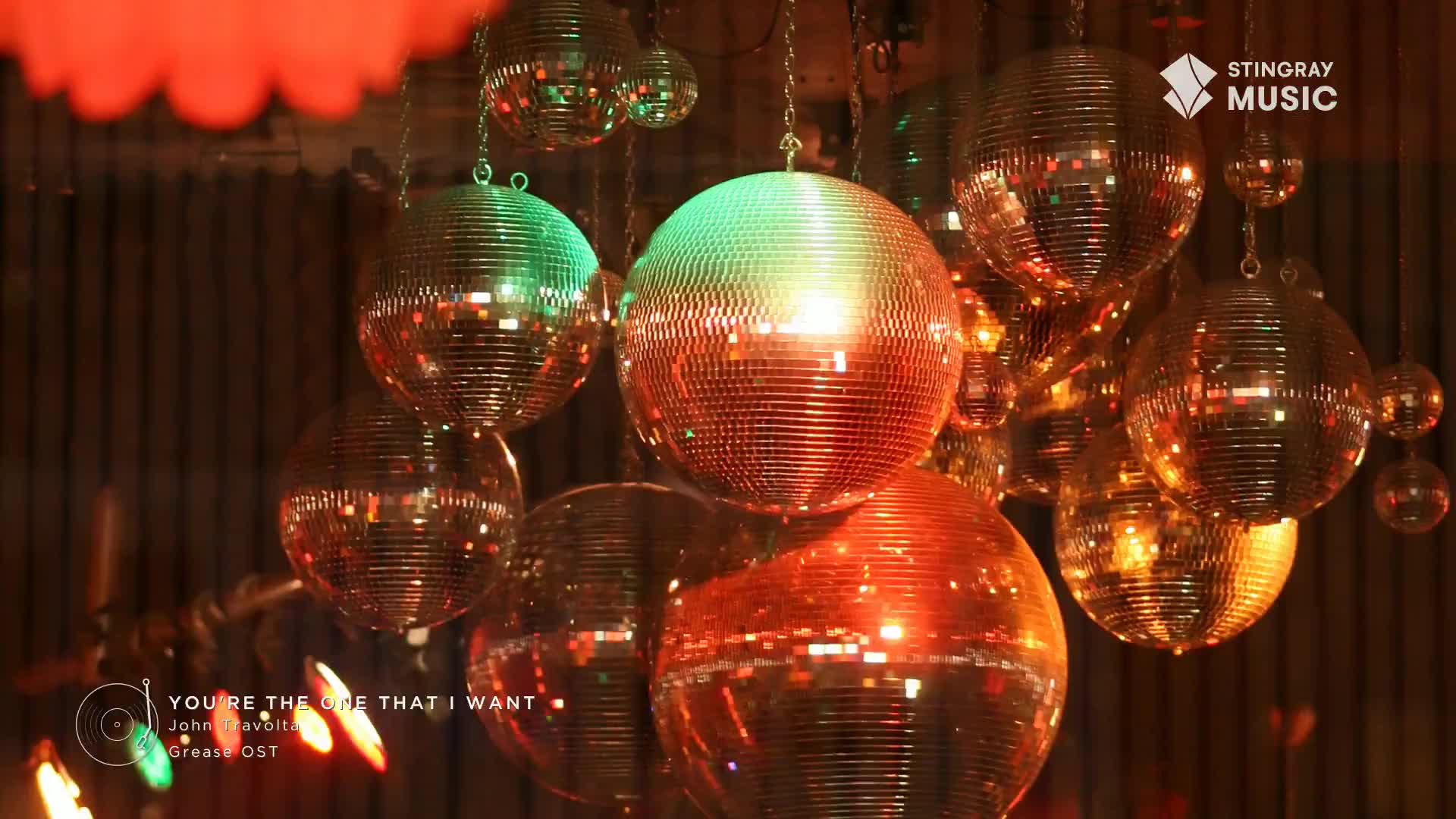 Glittering disco balls hang from the ceiling, reflecting warm light. It's a throwback to the 70s, a Stingray Flashback from Canada, and the music is cranking.
