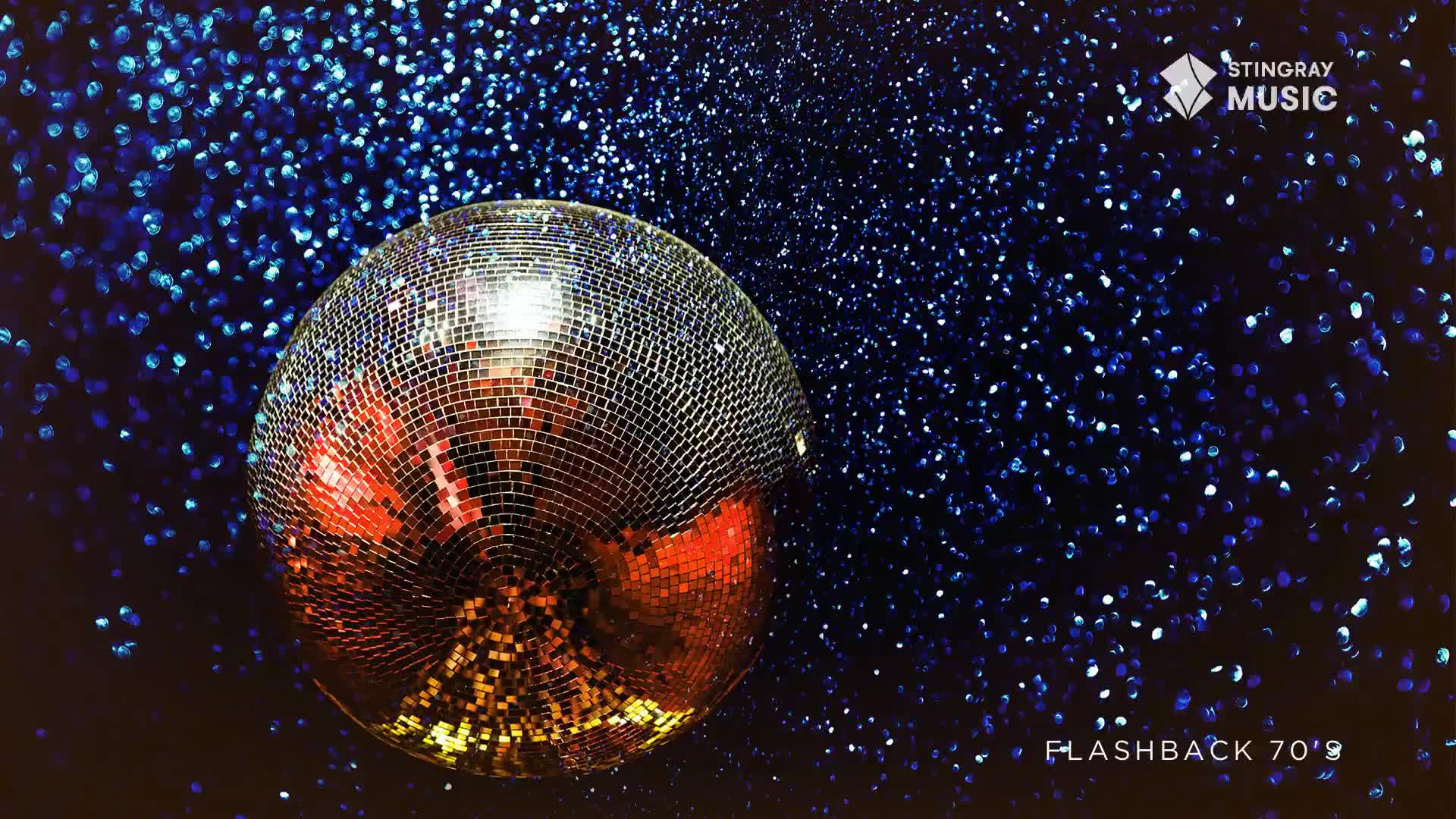 A mirrored disco ball, reflecting warm hues, sits against a backdrop of sparkling blue. The Stingray Flashback 70's logo is visible, a nod to Canada's musical past.
A mirrored disco ball, reflecting warm hues, sits against a backdrop of sparkling blue. The Stingray Flashback 70's logo is visible, a nod to Canada's musical past.