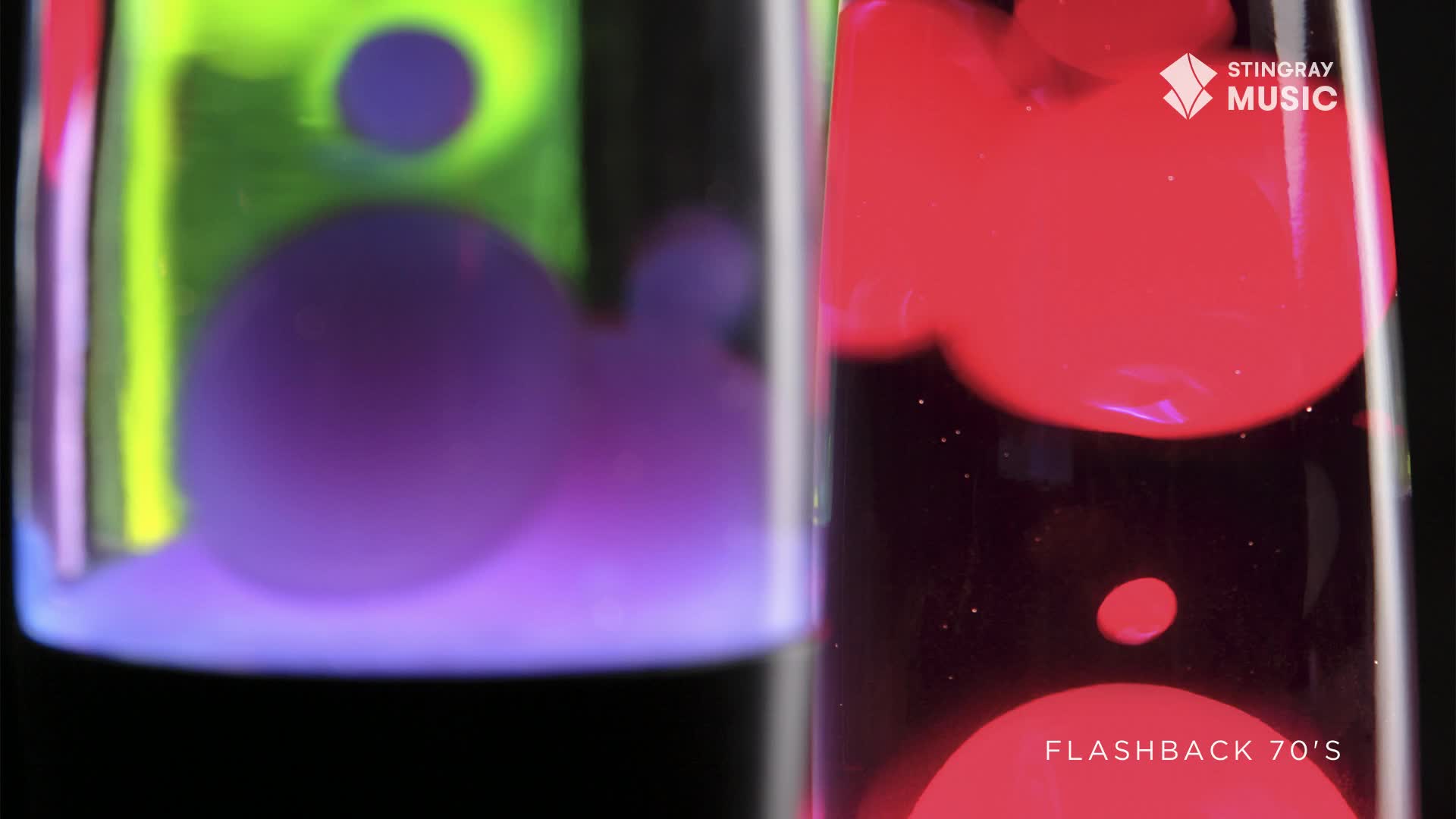 Purple and red blobs drift and swell inside two lava lamps, a visual from Canada's Stingray Flashback 70's. The liquid's movement is slow, hypnotic, and reminiscent of a bygone era.
Purple and red blobs drift and swell inside two lava lamps, a visual from Canada's Stingray Flashback 70's. The liquid's movement is slow, hypnotic, and reminiscent of a bygone era.