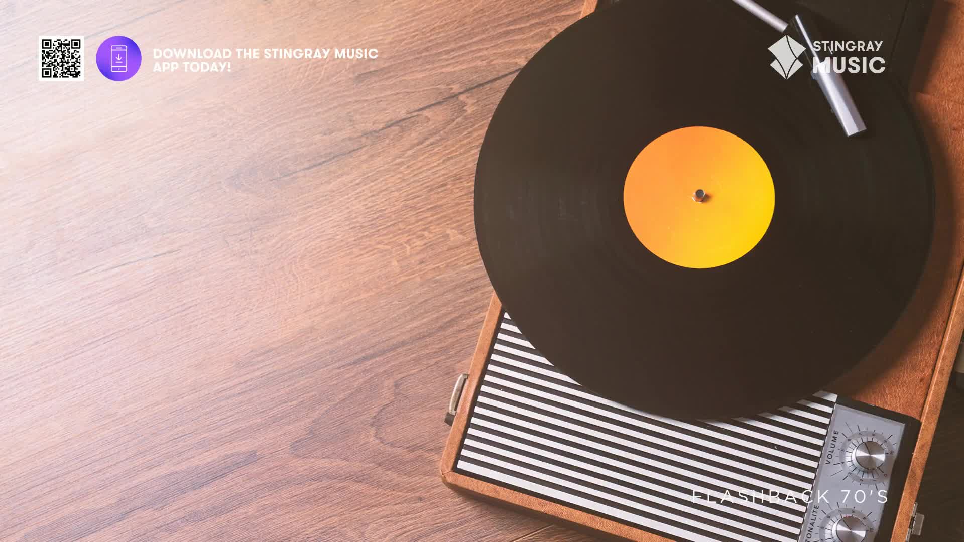 The needle drops onto a spinning vinyl record, its orange label catching the light.  This is how we're getting our 70's fix in Canada.