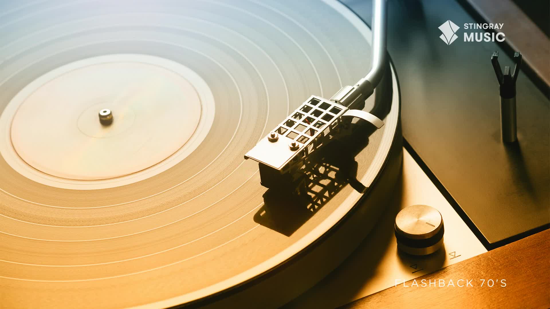 The vinyl record spins, its grooves catching the light as the tonearm settles into place. This is the sound of a 70s flashback, a classic Canadian tune about to play.