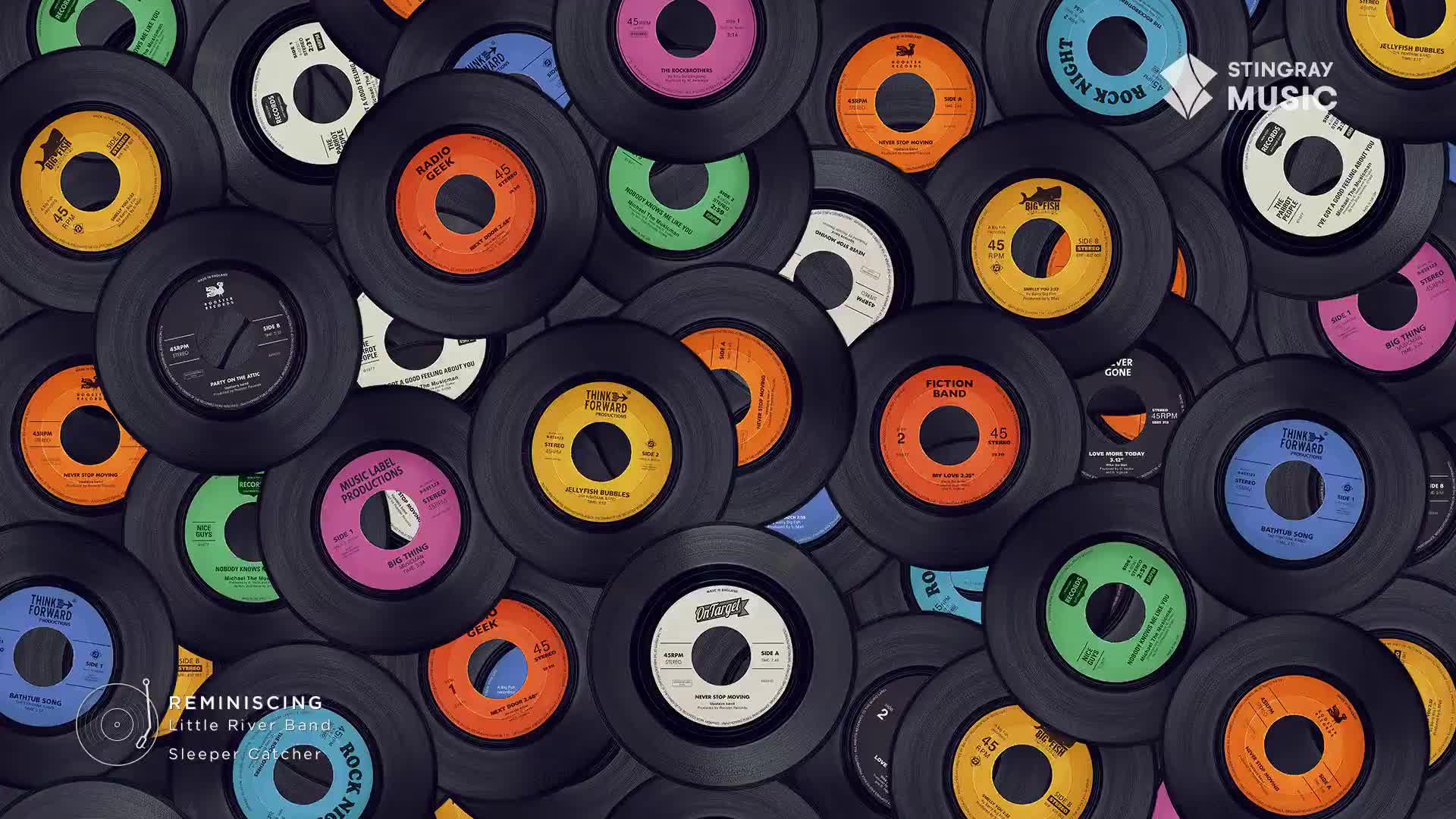 A scattered collection of 45 RPM records, some with bright labels, are piled on top of each other. It feels like a Canadian attic, a Stingray Flashback to the 70s, full of forgotten treasures.
