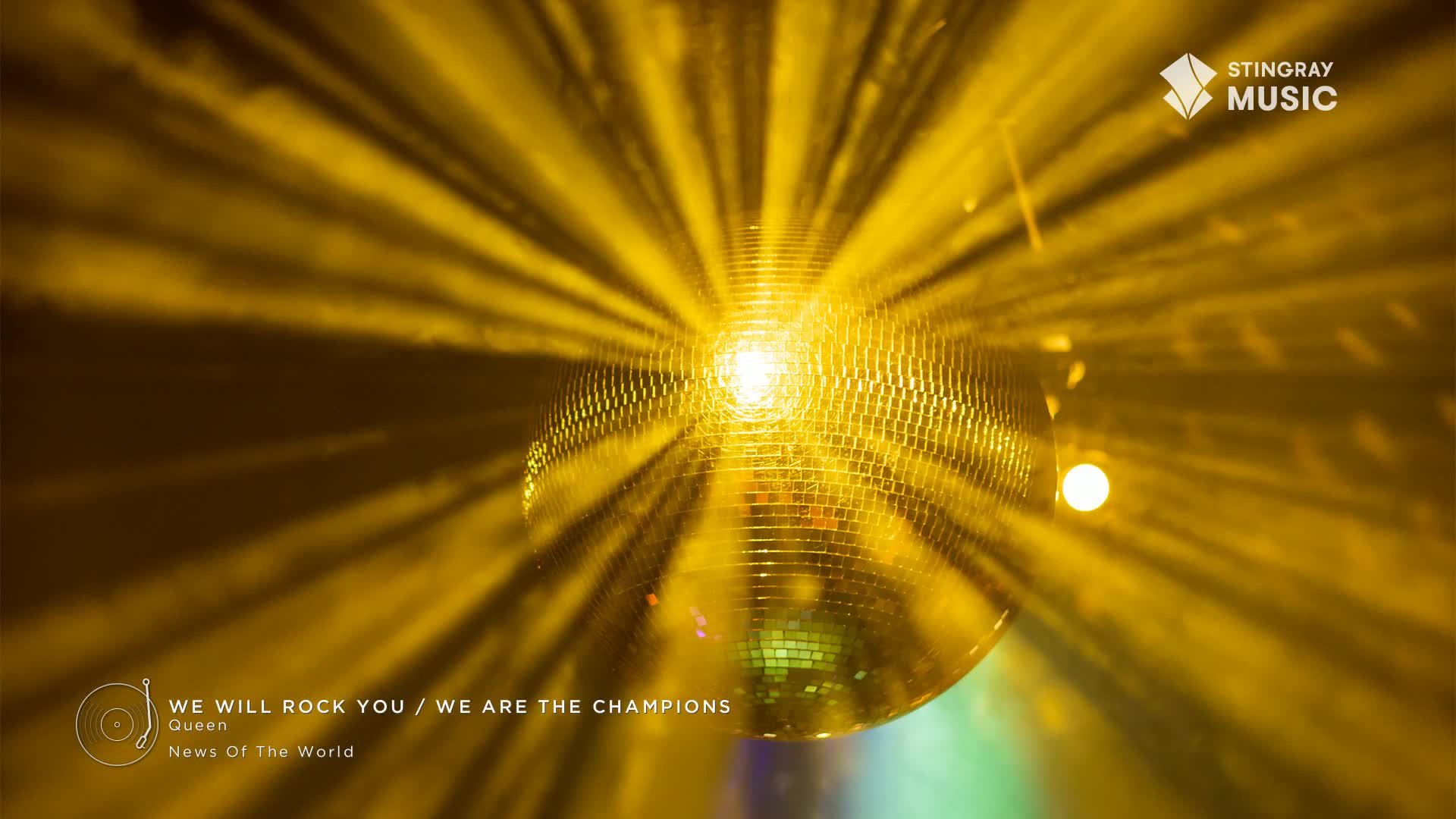 A mirrored disco ball hangs, sending sharp yellow beams across the smoky air. The iconic sound of Queen's "We Will Rock You" fills the space, a fitting soundtrack for this 70s flashback.