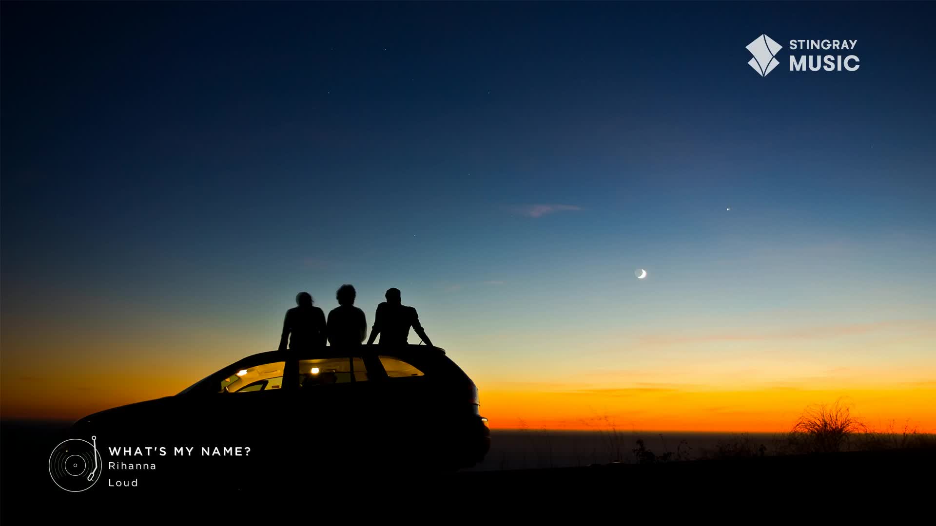 Three figures sit silhouetted on a car roof, gazing at the sky as the sun sets. The Stingray Hit List logo sits in the corner, and Rihanna's "What's My Name?" is playing.
