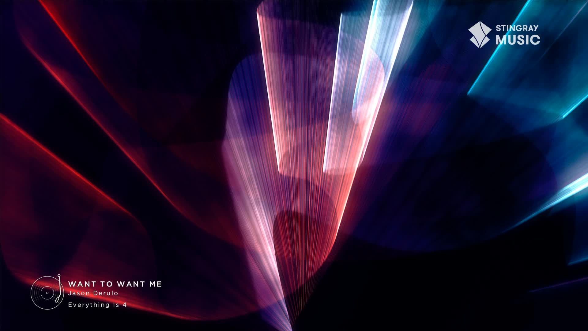 The background is a dark canvas with streaks of red and blue light, likely from a Stingray Hit List broadcast in Canada.  The graphic for Jason Derulo's "Want to Want Me" is visible in the lower left.
