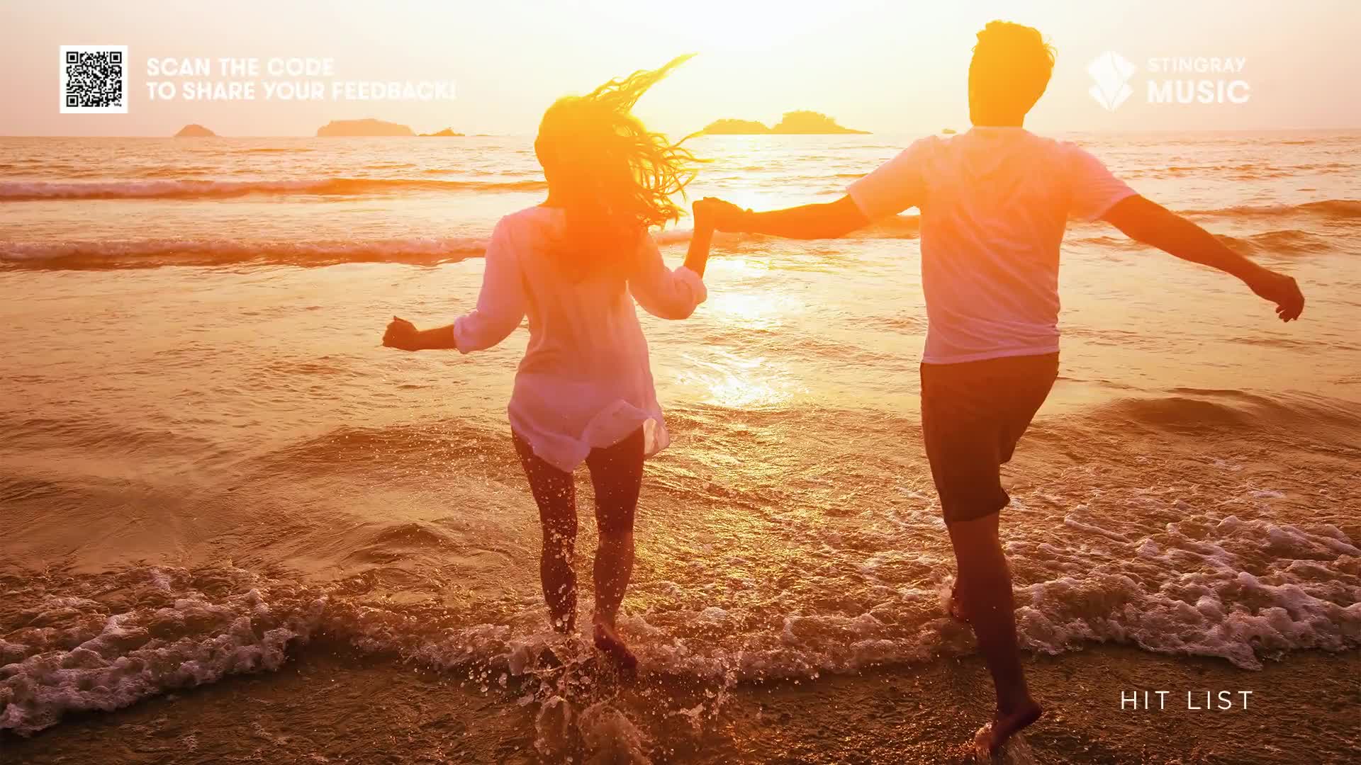 A couple, silhouetted by the sunset, runs hand-in-hand through the shallow waves. The Stingray Hit List logo is visible, but the focus is on their carefree joy.
