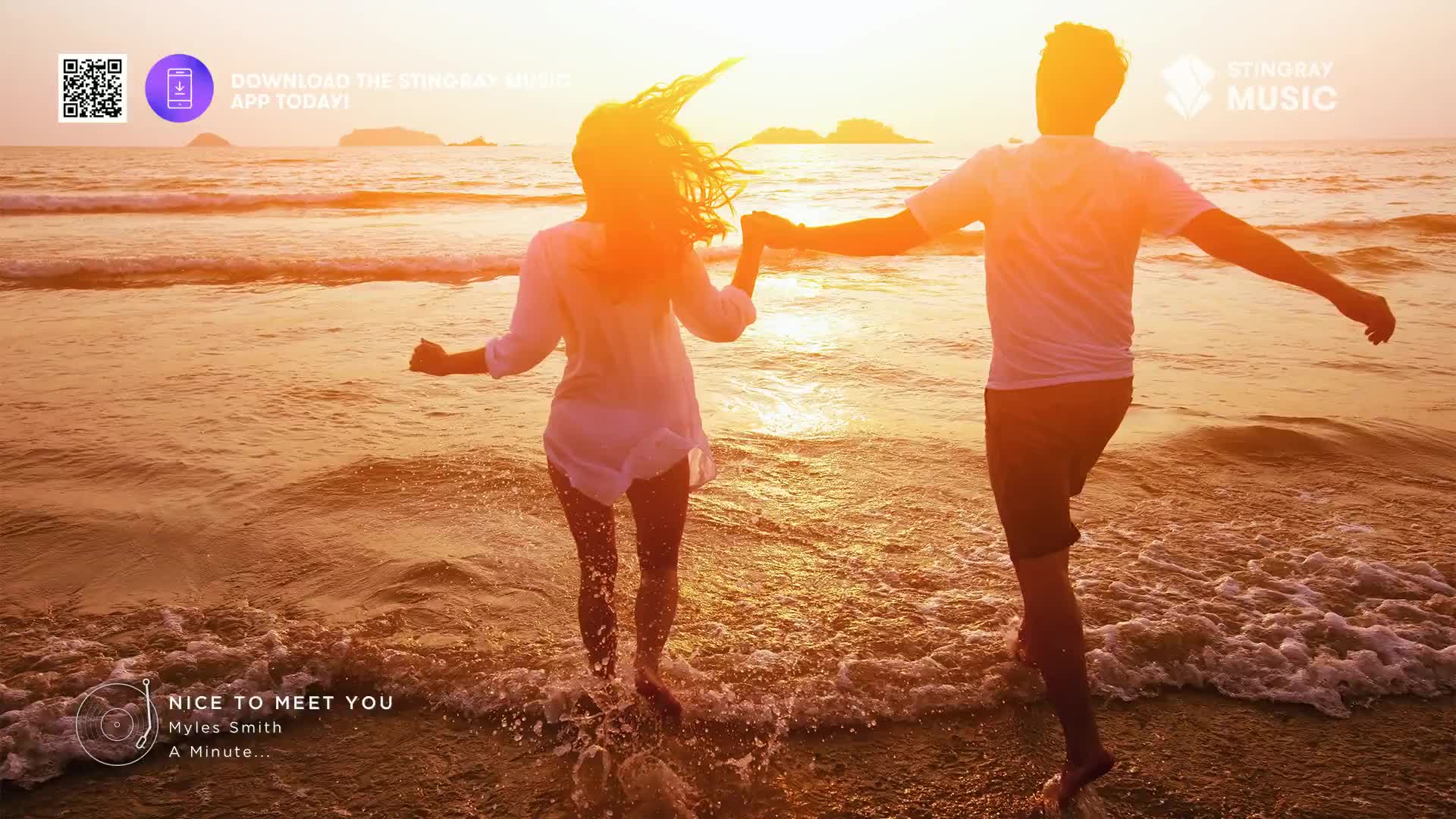 A couple, hand-in-hand, runs through the shallow water toward the setting sun. The woman's hair whips behind her, and the man's arms are outstretched as they splash through the waves.
