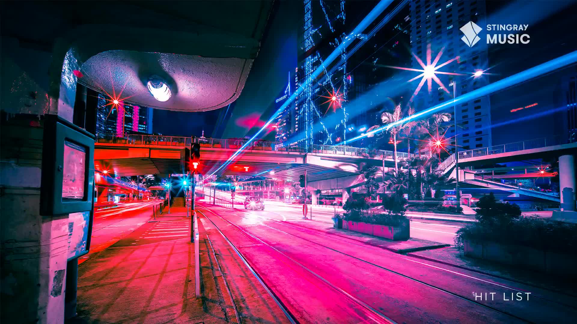The street glows a neon pink, and streaks of light from passing vehicles blur across the pavement. Overhead, the underpass casts a purple light, and the Stingray Hit List logo is visible in the corner.
The street glows a neon pink, and streaks of light from passing vehicles blur across the pavement. Overhead, the underpass casts a purple light, and the Stingray Hit List logo is visible in the corner.