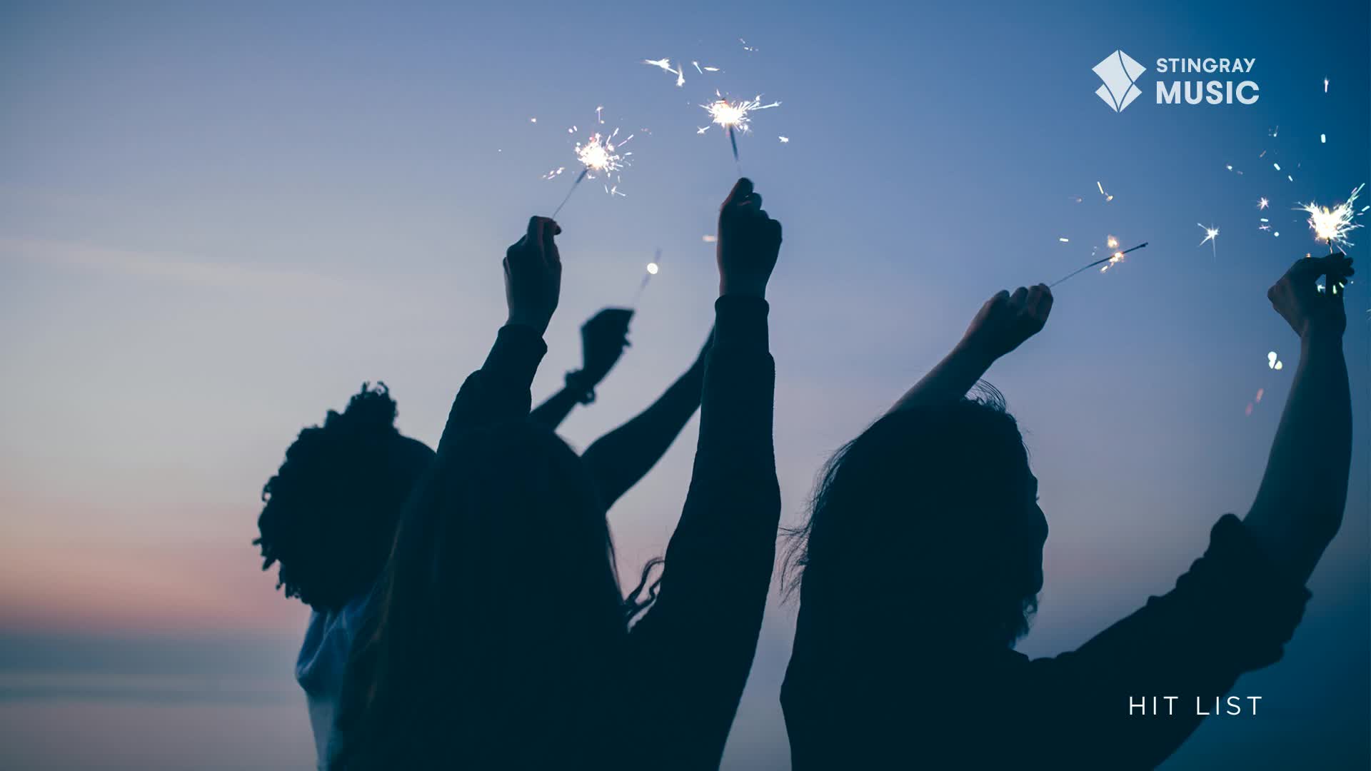 Hands reach up, holding sparklers that crackle and send tiny bursts of light into the twilight sky. The Stingray Hit List is playing, and it feels like a celebration.