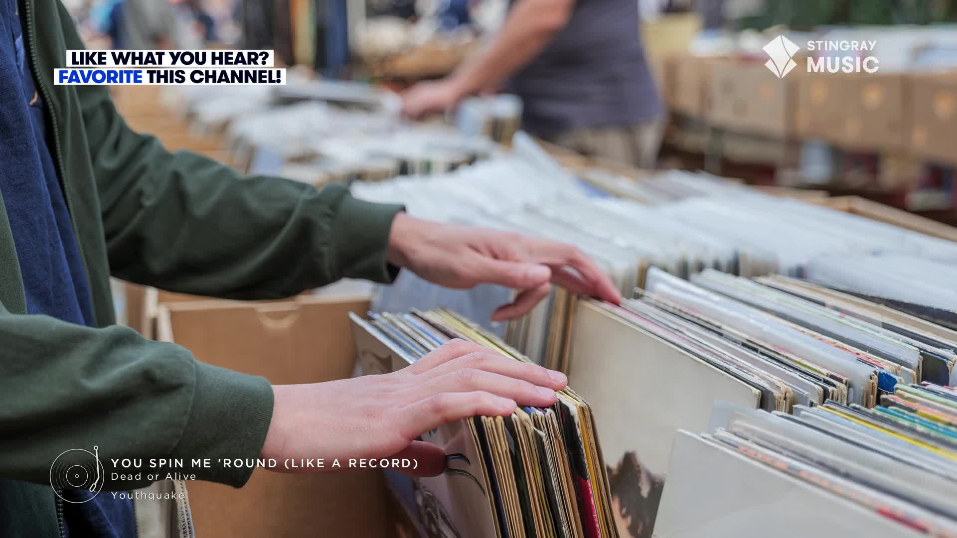 Someone's carefully flipping through the vinyl records, searching for a hidden gem. The Stingray Music logo sits in the corner, a reminder of the music playing in the background.
