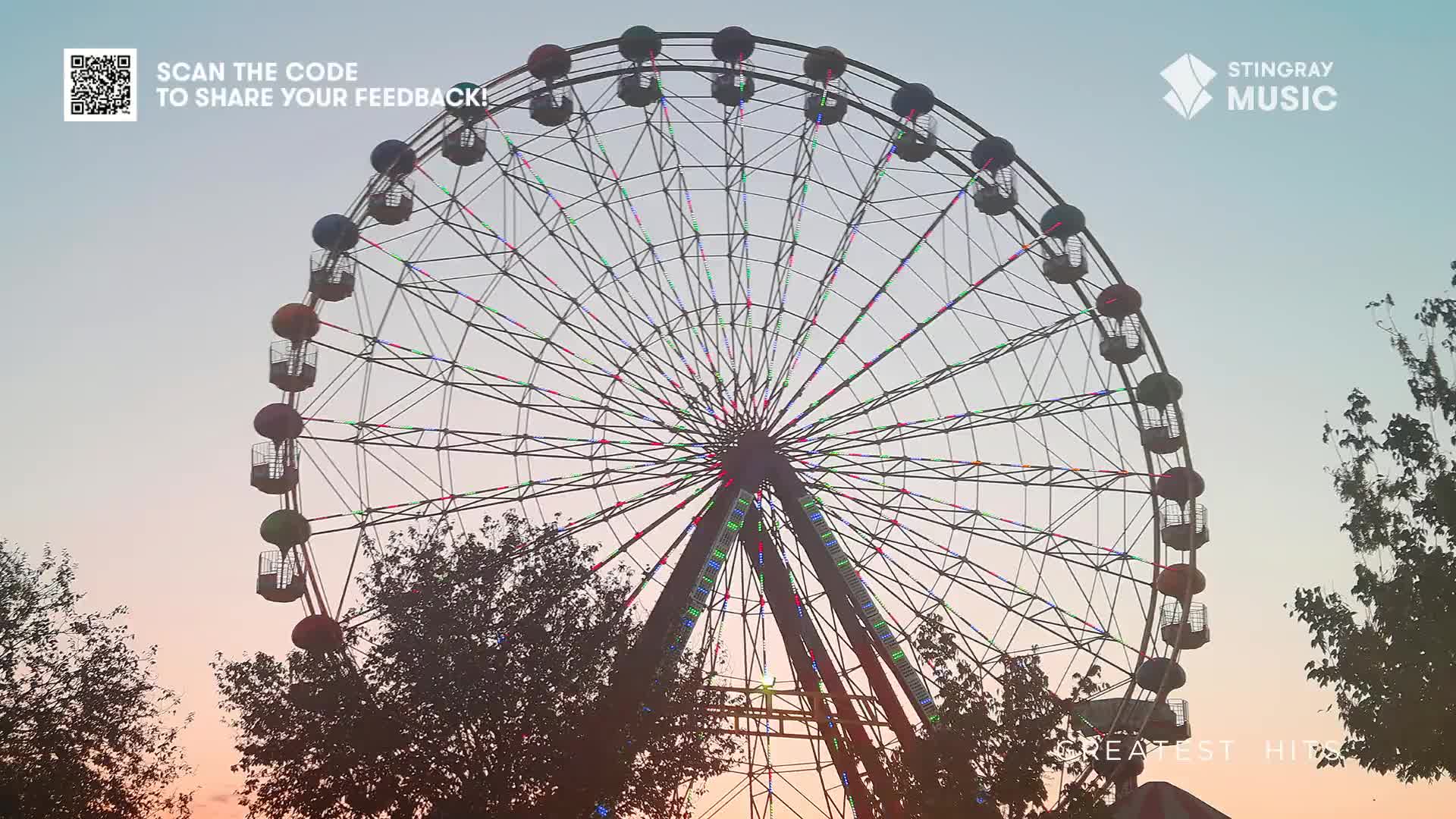 The Ferris wheel's silhouette is stark against the sky, its colourful cars poised for a ride. Below, the Stingray Music logo suggests this is a perfect backdrop for a Canadian holiday playlist.
