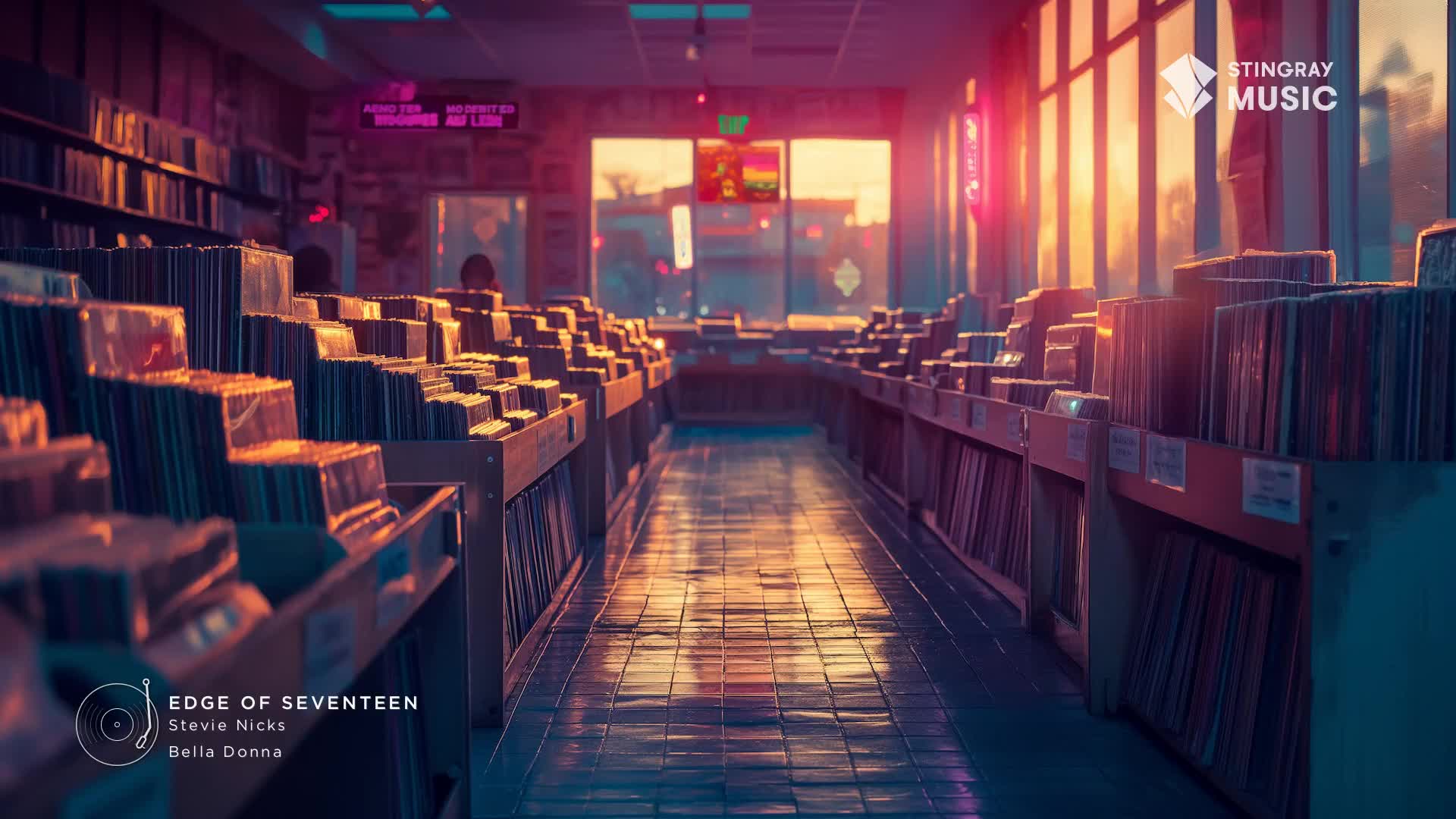 The warm glow of the setting sun spills through the window of a record store, illuminating rows of vinyl. Inside, the air is still, and the promise of Stingray Holiday Hits and some Stevie Nicks is in the air.
