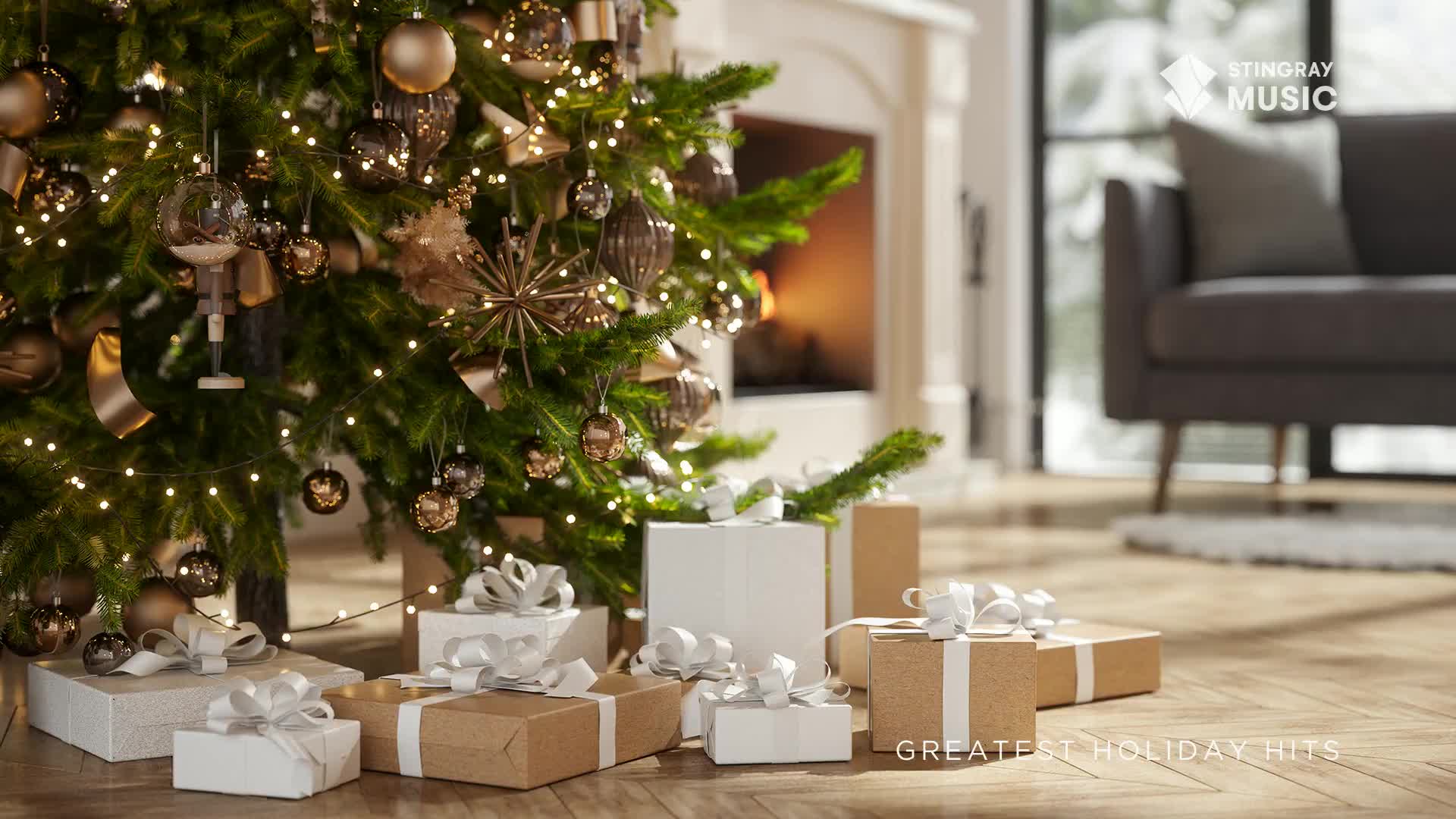 A decorated Christmas tree, lit with tiny lights, towers over a collection of wrapped gifts. The scene feels cozy, with a fireplace glowing softly in the background, perfect for listening to Stingray's Holiday Hits.
