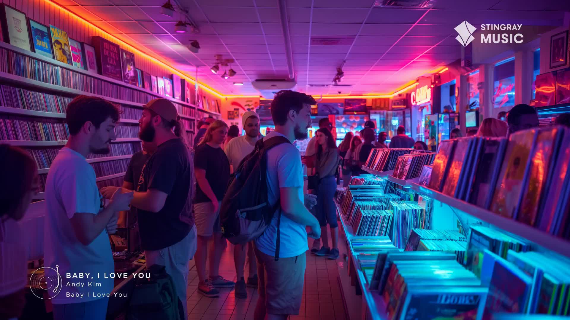 The neon lights of this Canadian record shop cast a vibrant glow over rows of vinyl. People browse the shelves, their faces illuminated by the pink and blue hues.