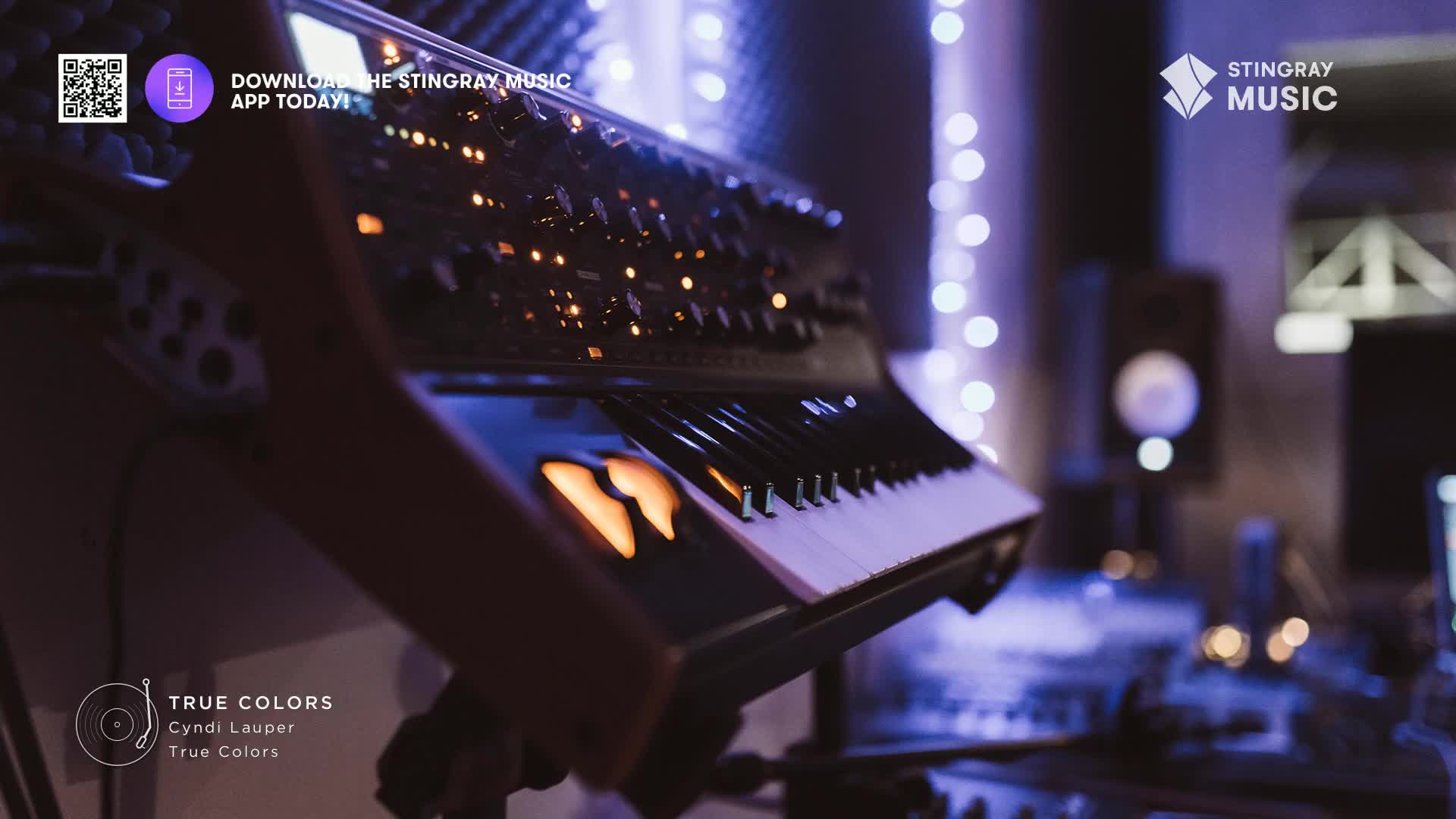A synthesizer's keys gleam under studio lights, hinting at the sounds of Cyndi Lauper's "True Colors." The Stingray Music app is available for download in Canada.