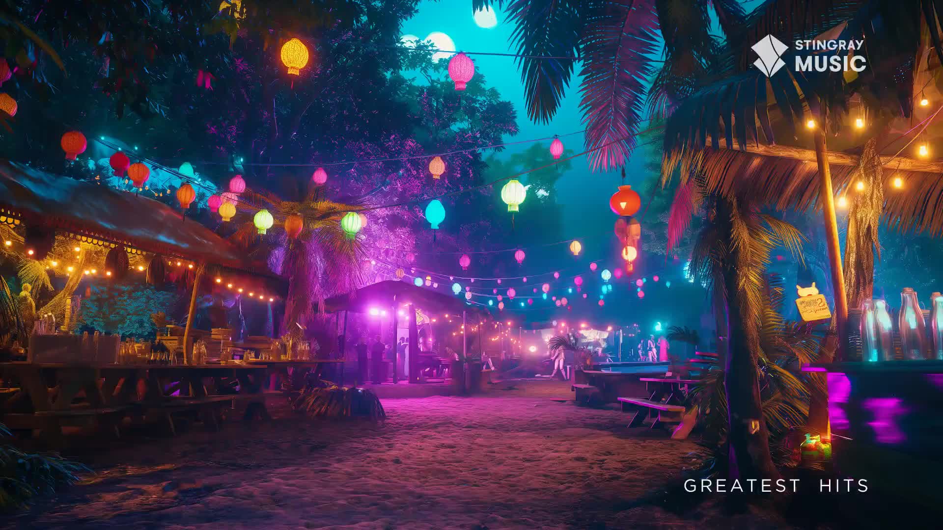 Colourful paper lanterns hang above a beachside bar, casting a vibrant glow on the sand. People mill about under the lights, enjoying the warm evening air.