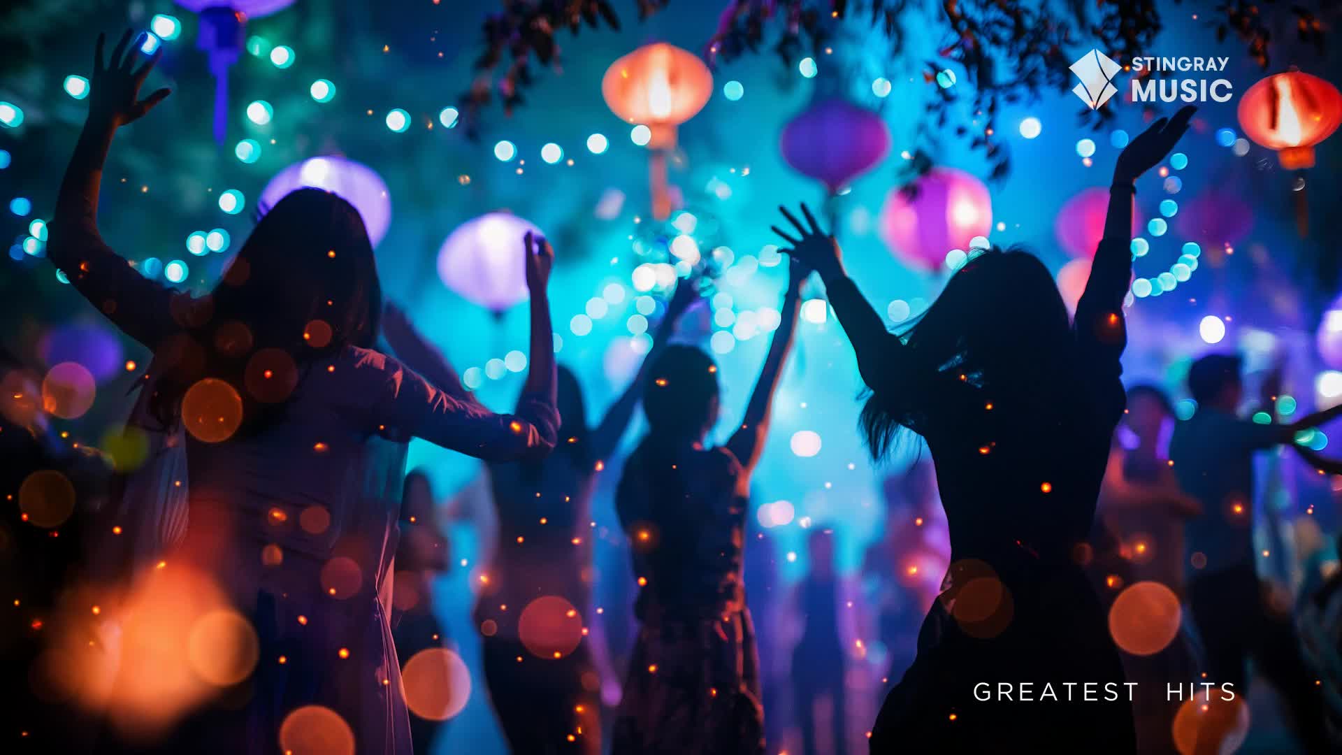 Silhouettes of people dance with their arms raised under a canopy of glowing lanterns. The air is filled with tiny, sparkling lights, creating a festive atmosphere reminiscent of a summer celebration in Canada.