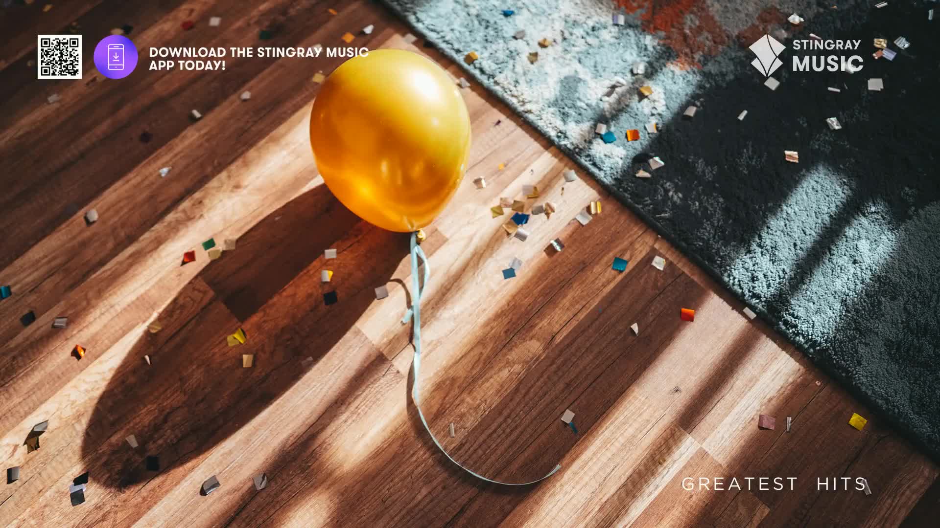 A solitary yellow balloon rests on a wooden floor, its ribbon curving across scattered confetti. Sunlight streams in, casting long shadows and highlighting the remnants of a Canadian celebration.
